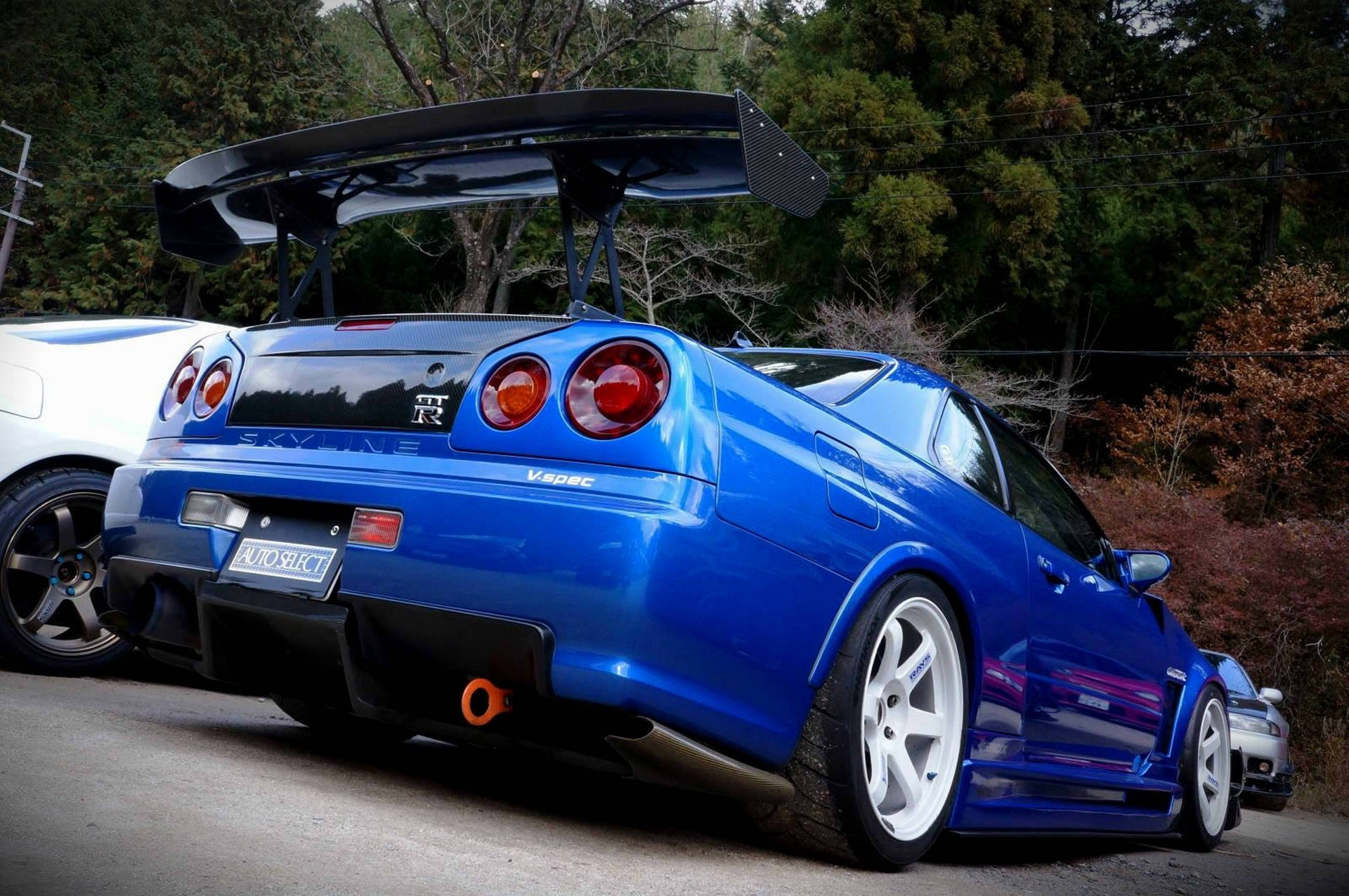 Toma majestuosa de un Nissan Skyline GTR R34 en alta definición. — Azul oscuro Fondos de pantalla