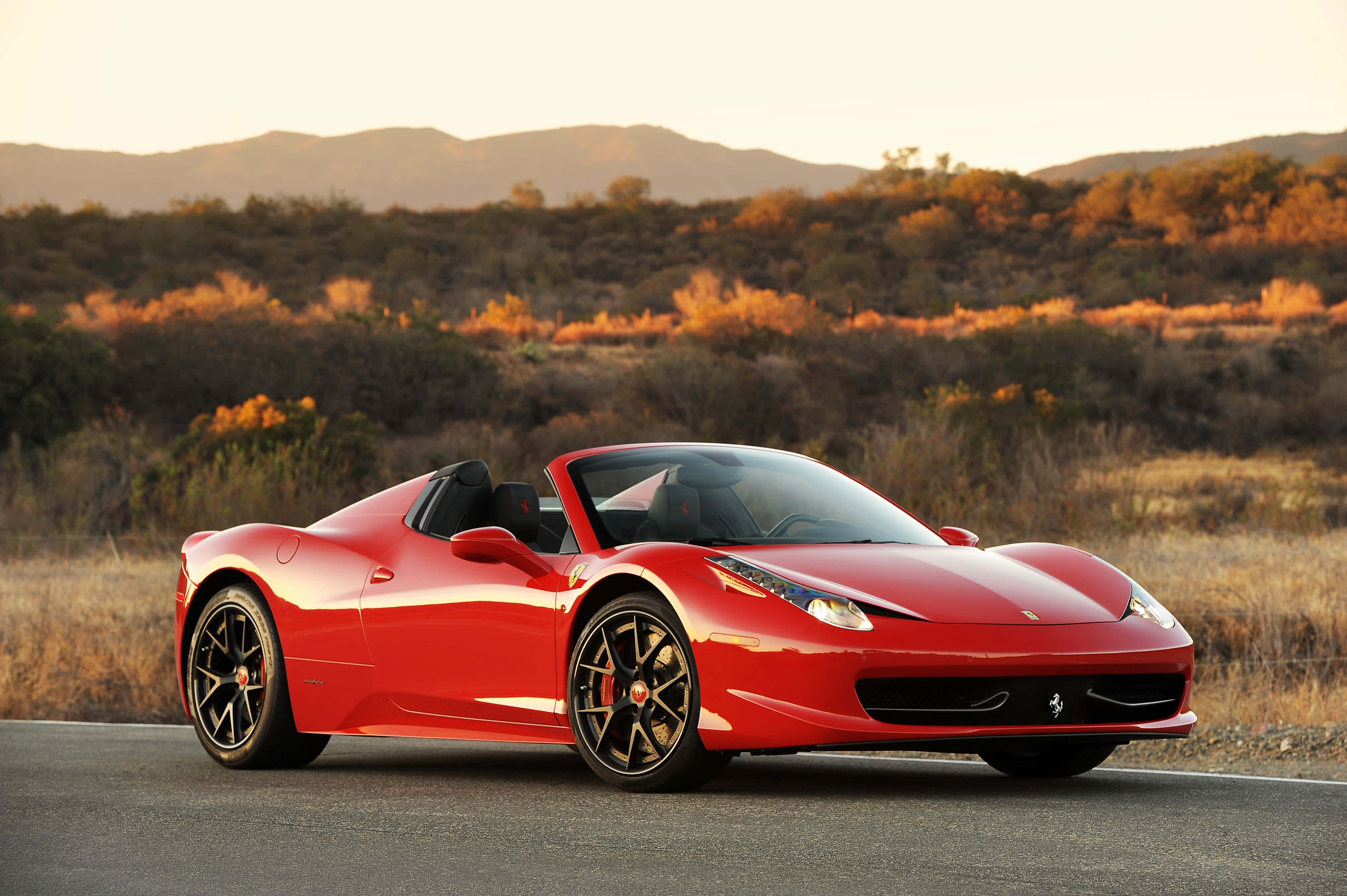 Abróchate el cinturón y vive la emoción de un paseo en un Ferrari Fondos de pantalla