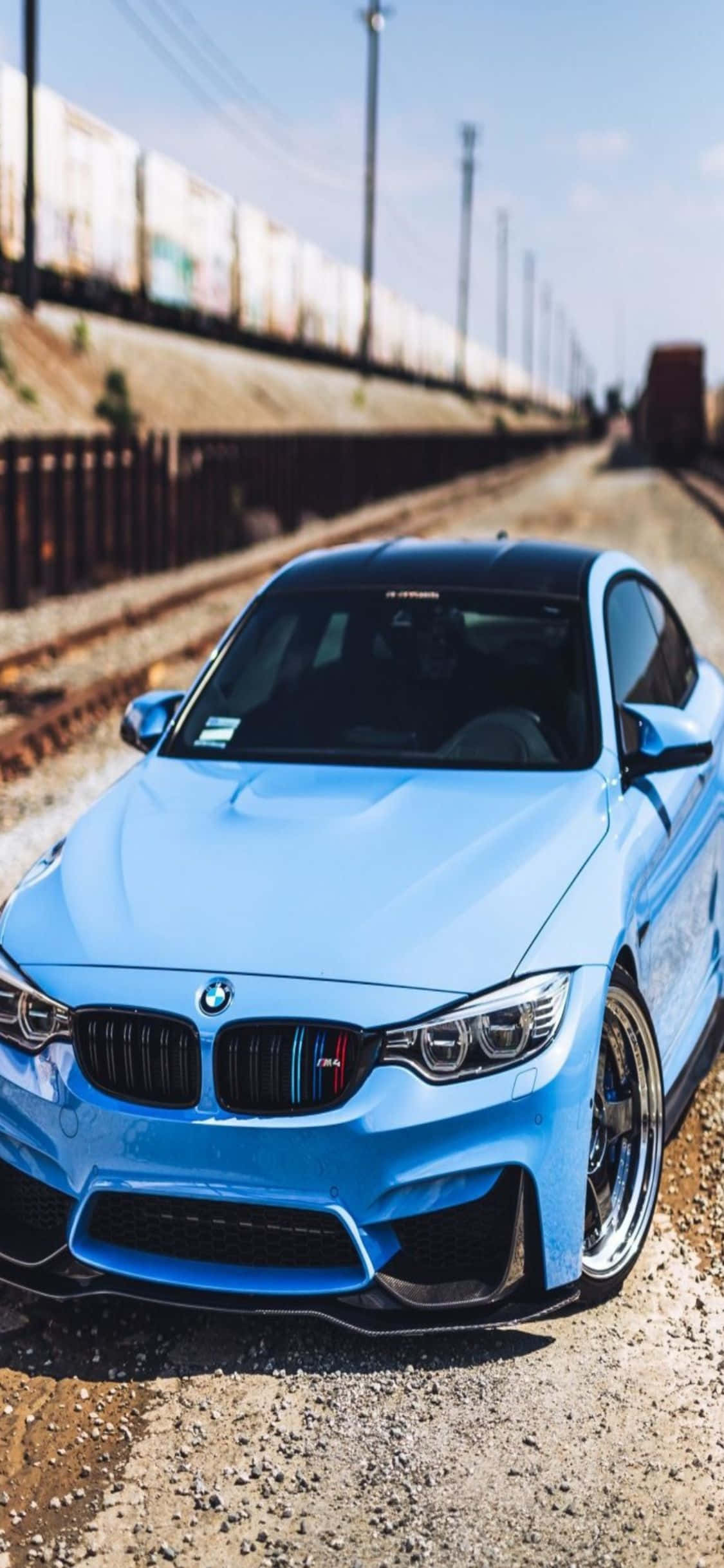 Alta tecnología y lujo. El iPhone X y un elegante BMW juntos. Fondos de pantalla