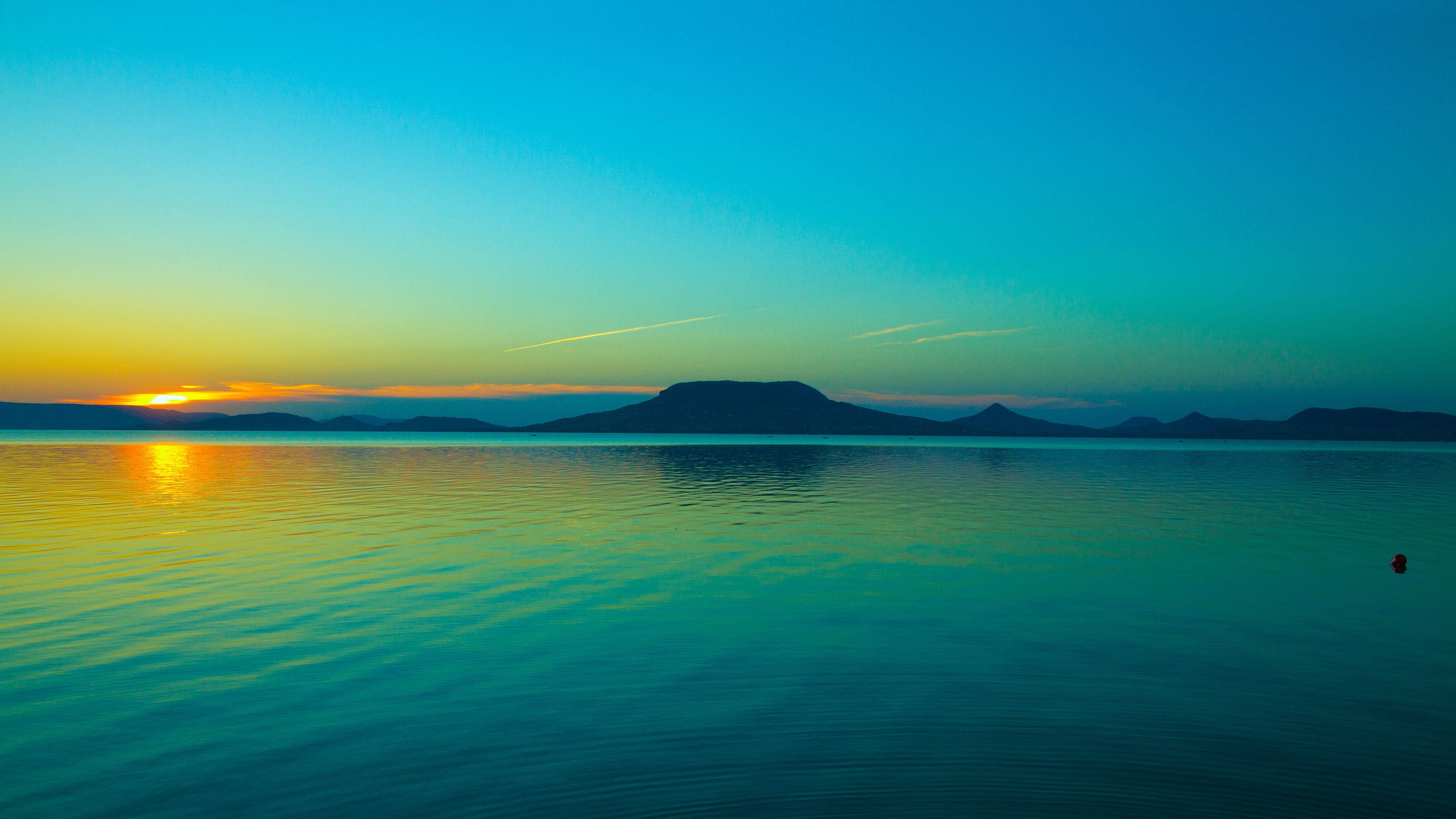 Atardecer Dorado en el Horizonte Fondos de pantalla