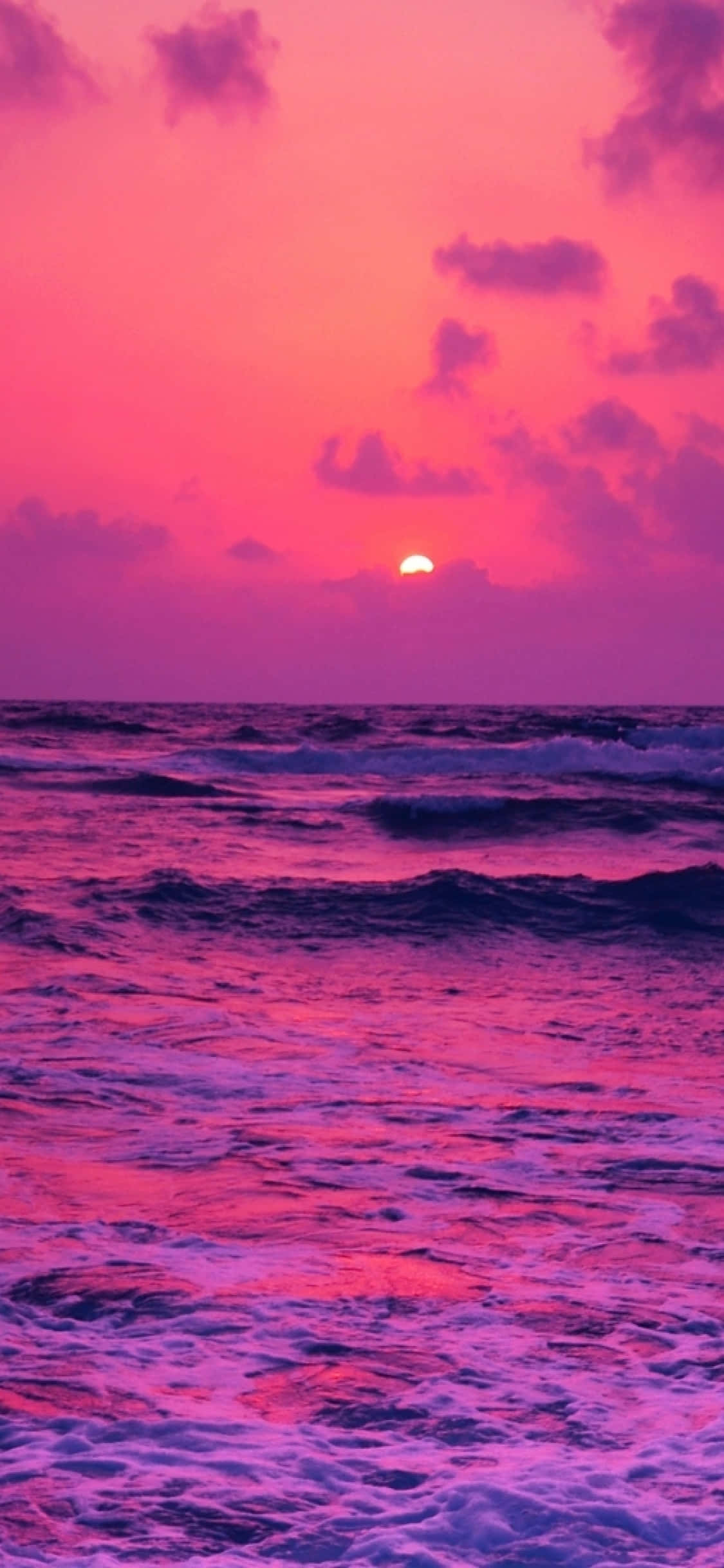 Atardecer en Playa Rosa con Nubes en el Horizonte Fondos de pantalla