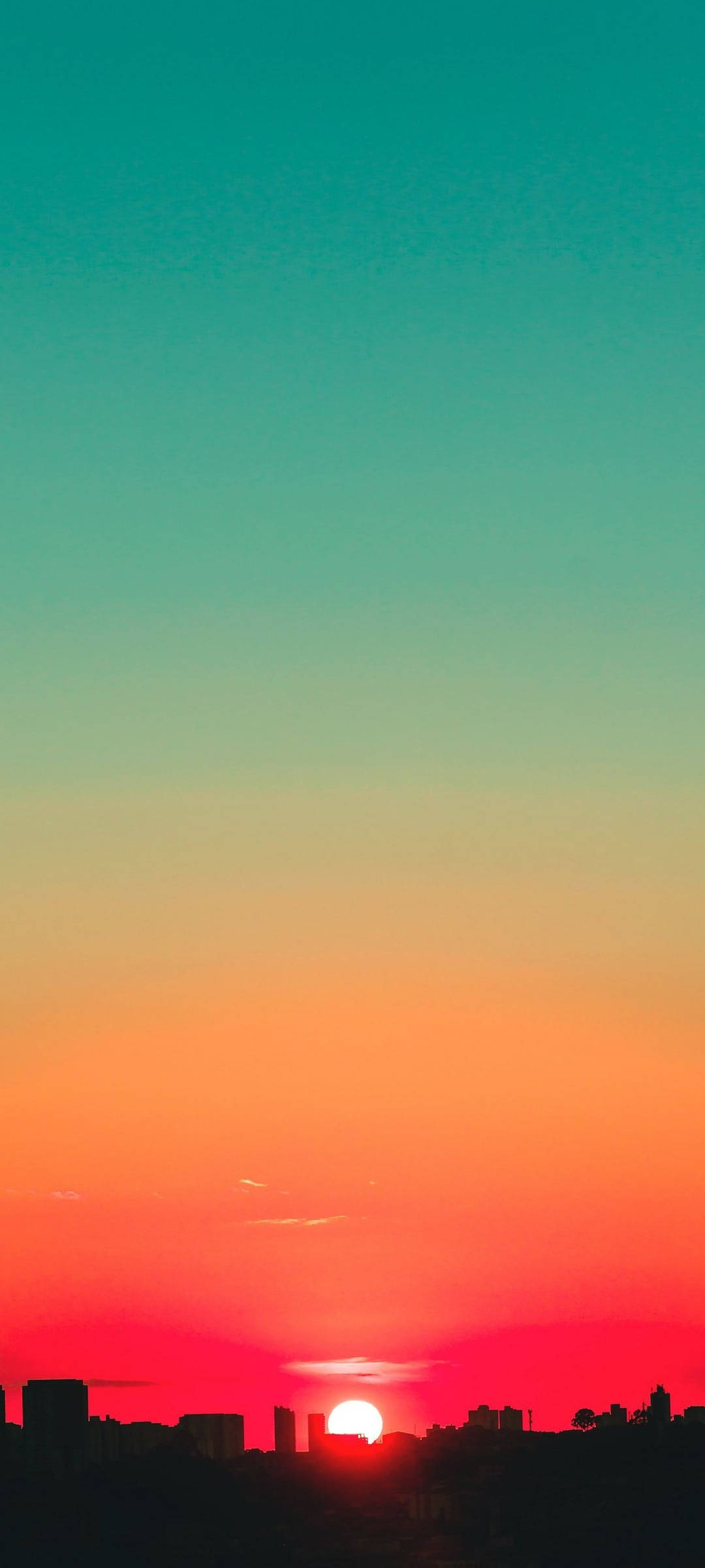 Cielo al atardecer en tonos verde azulado y rojo Fondos de pantalla