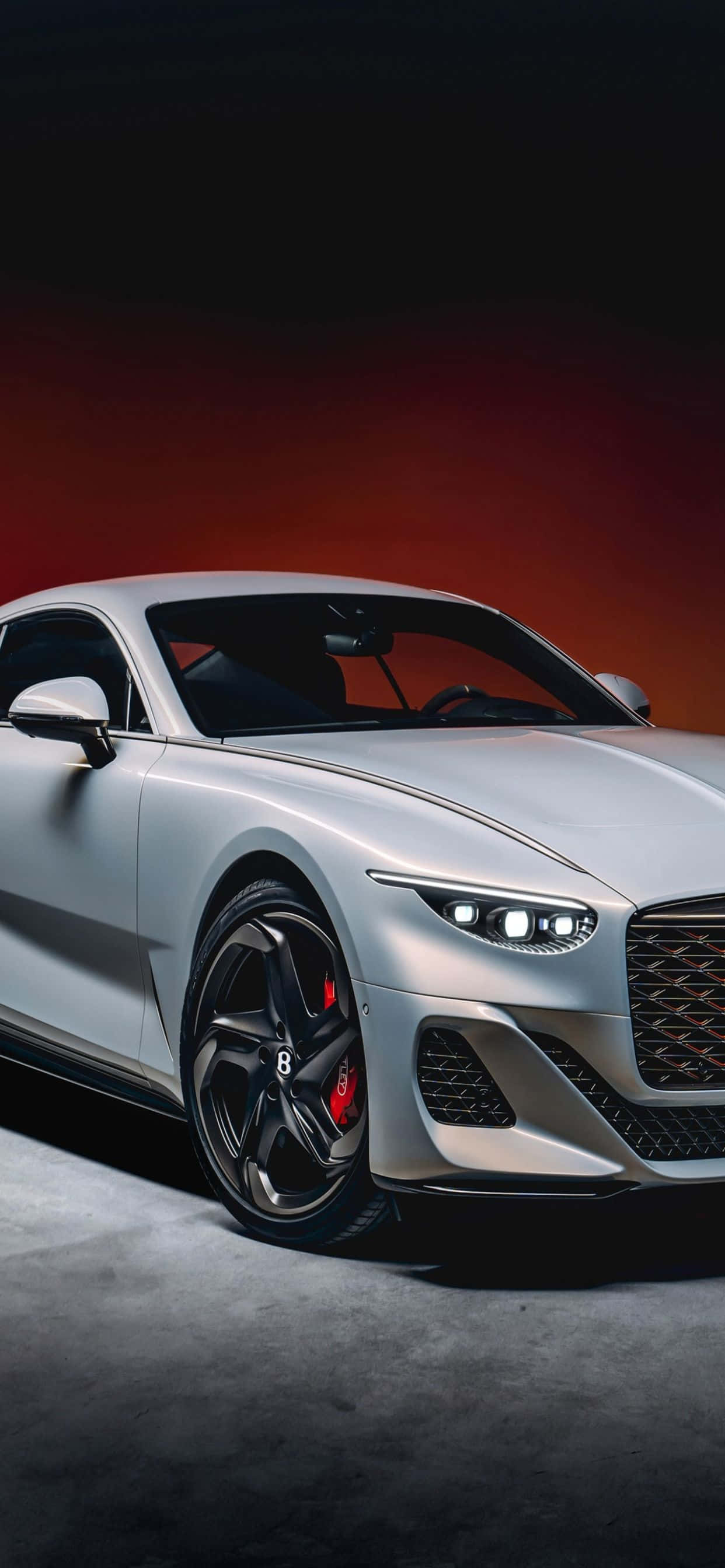 Disfruta de los lujos de la elegancia y la tecnología con este iPhone Xs MAX en un elegante Bentley. Fondos de pantalla