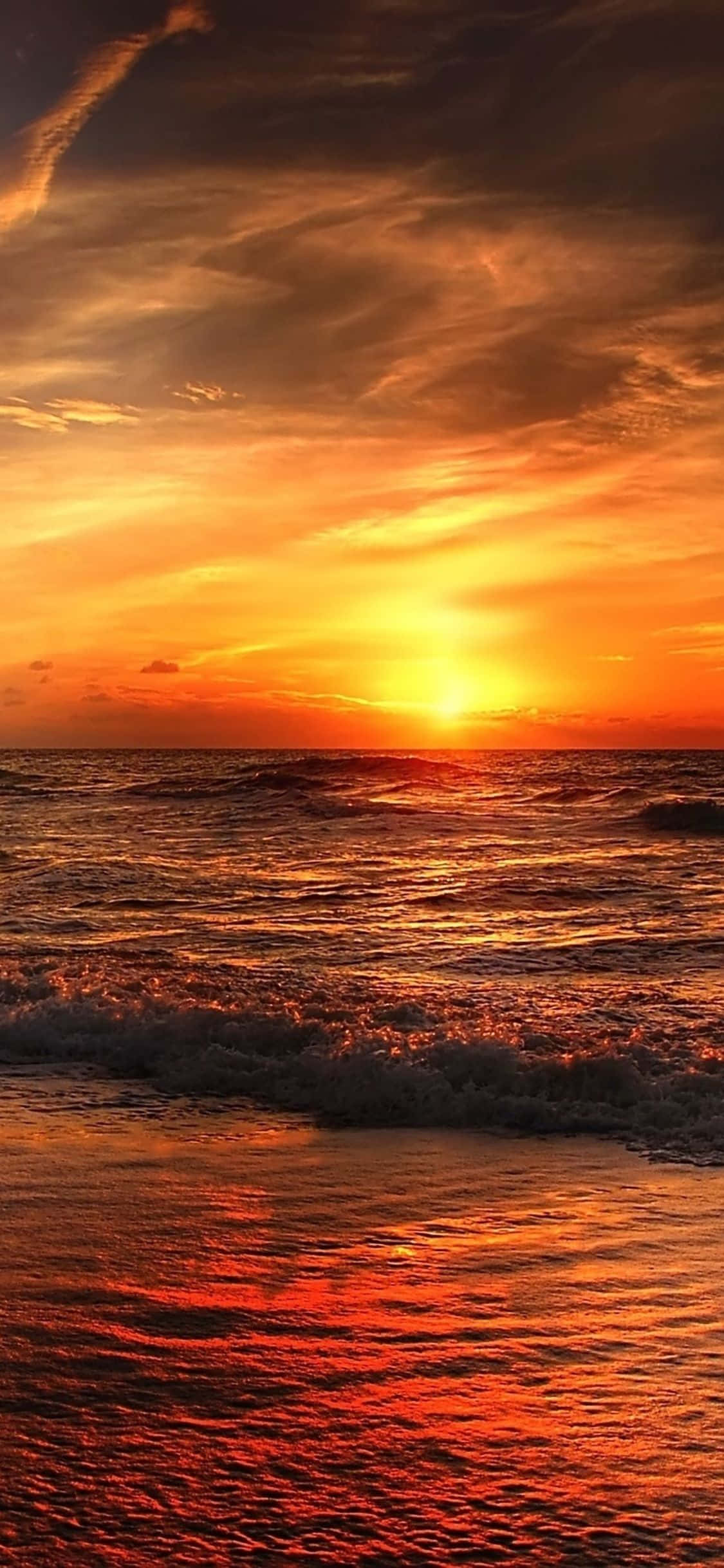 Disfruta del atardecer en la playa con tu iPhone Fondos de pantalla