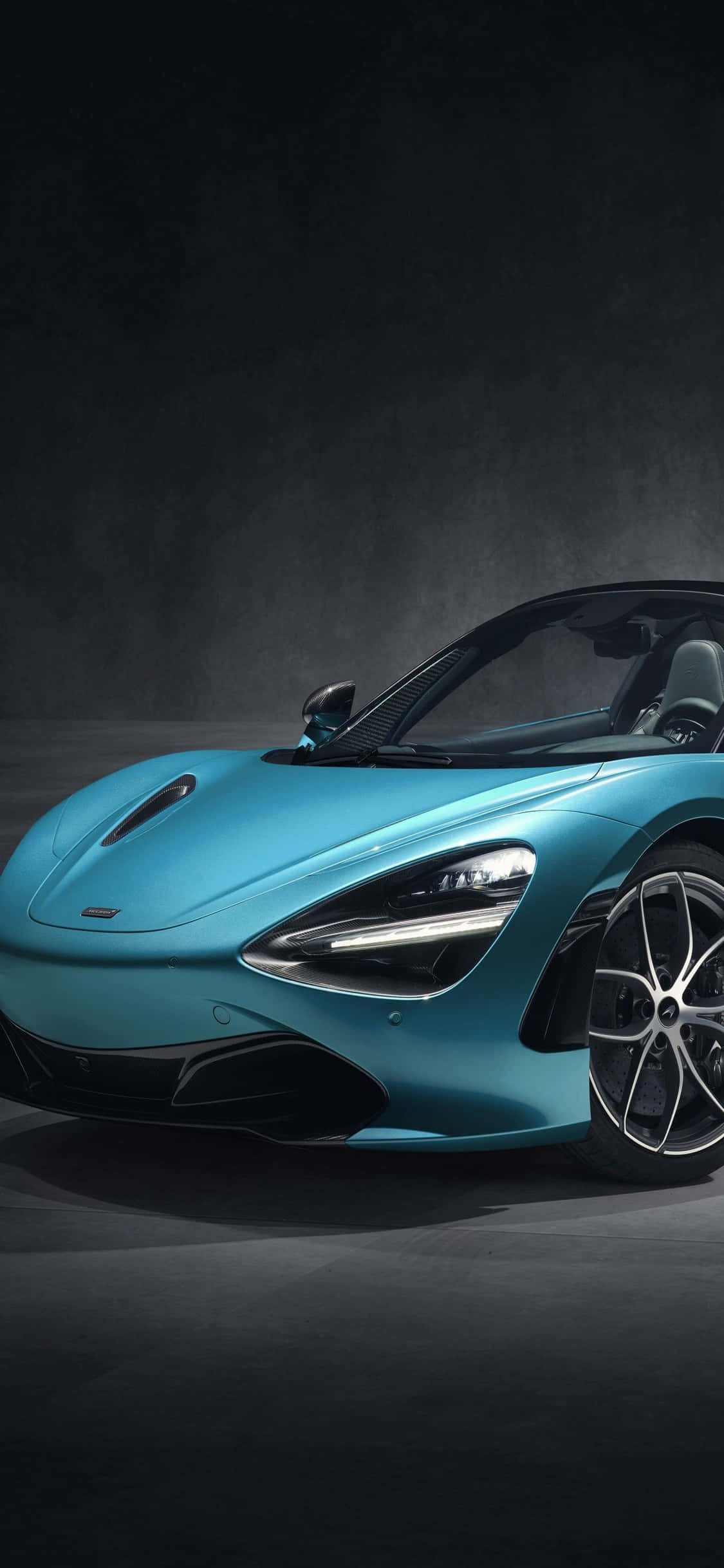 Dos íconos de velocidad y rendimiento: el iPhone Xs y el McLaren 720s Fondos de pantalla