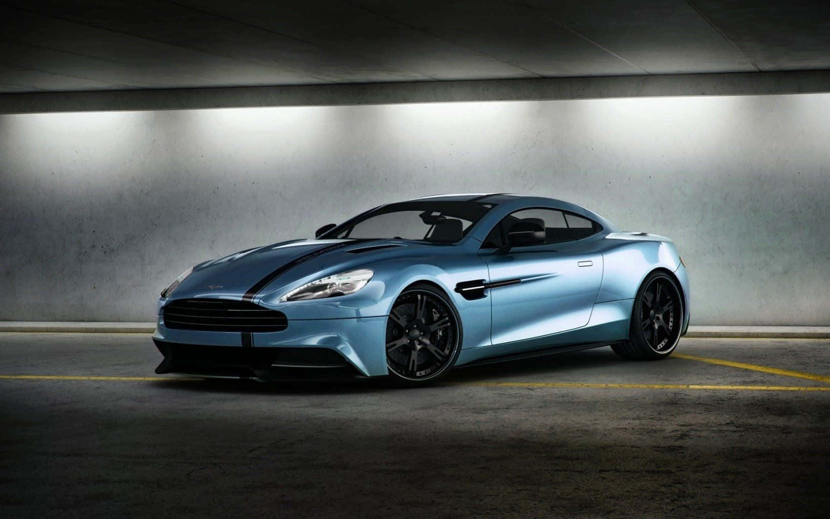 Elegante Aston Martin Vanquish en Movimiento Fondos de pantalla