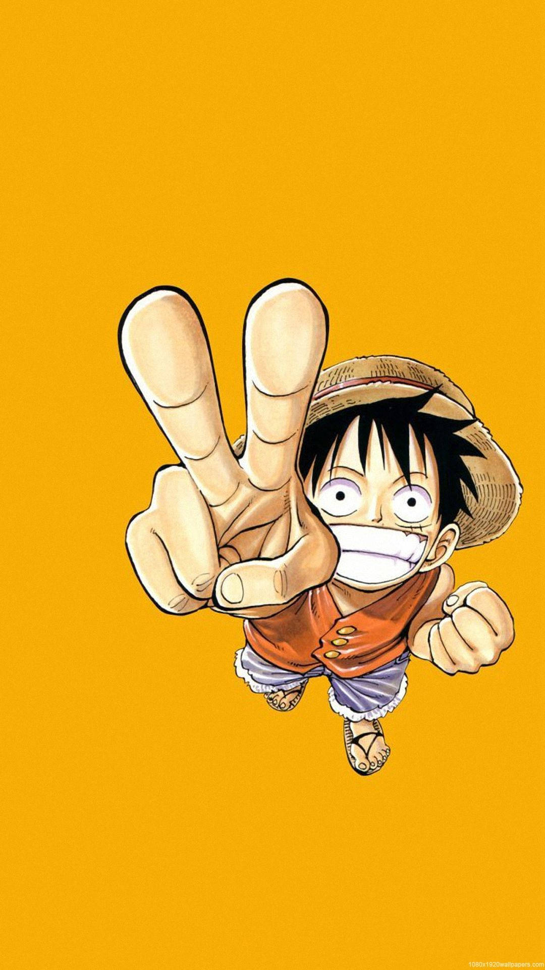 Fondo de pantalla de One Piece con Luffy haciendo señal de paz