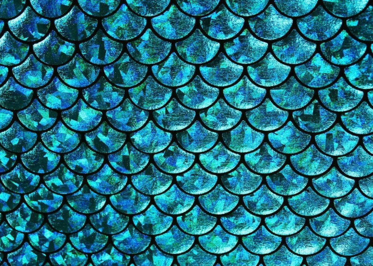 Fondo de pantalla aguamarina de escamas de sirena brillando como gemas.
