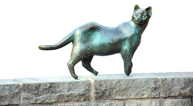 Escultura de gato de bronce en repisa de piedra Fondos de pantalla