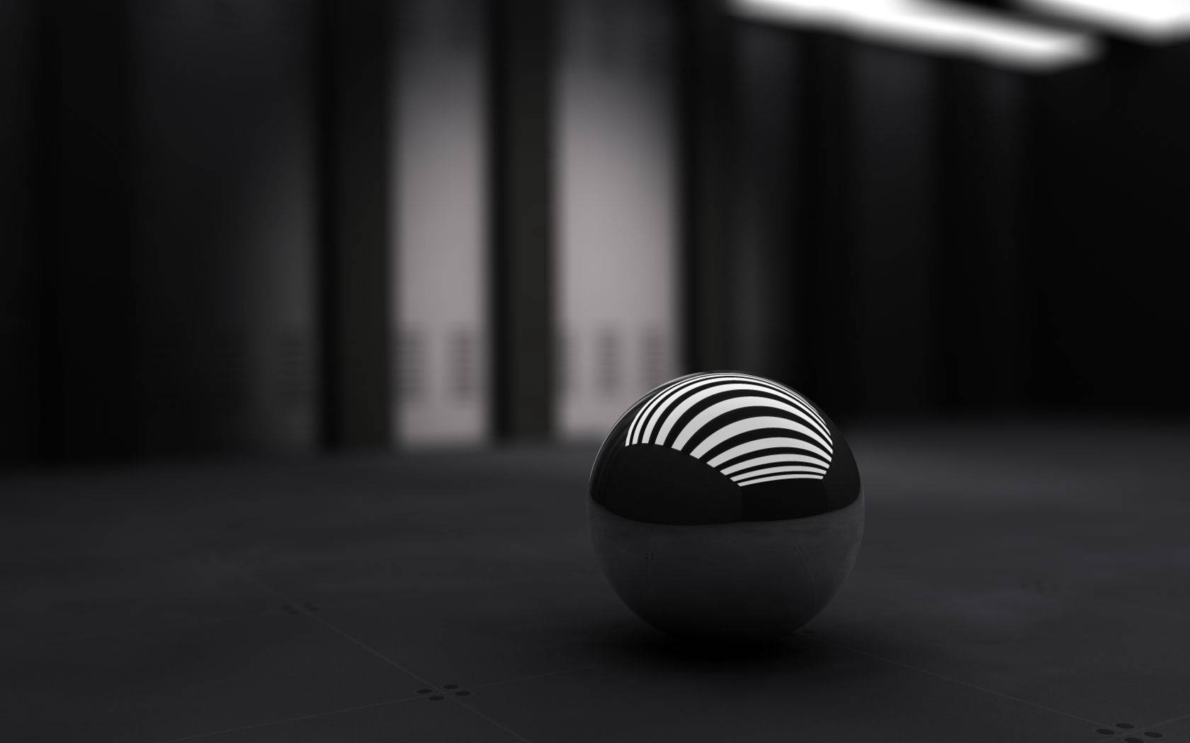 Fondo de pantalla de escritorio 3D de una pequeña esfera negra.