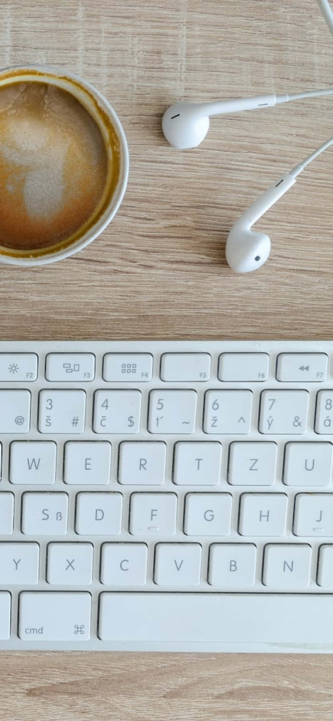 Fondo de escritorio iPhone X con audífonos y teclado Fondos de pantalla