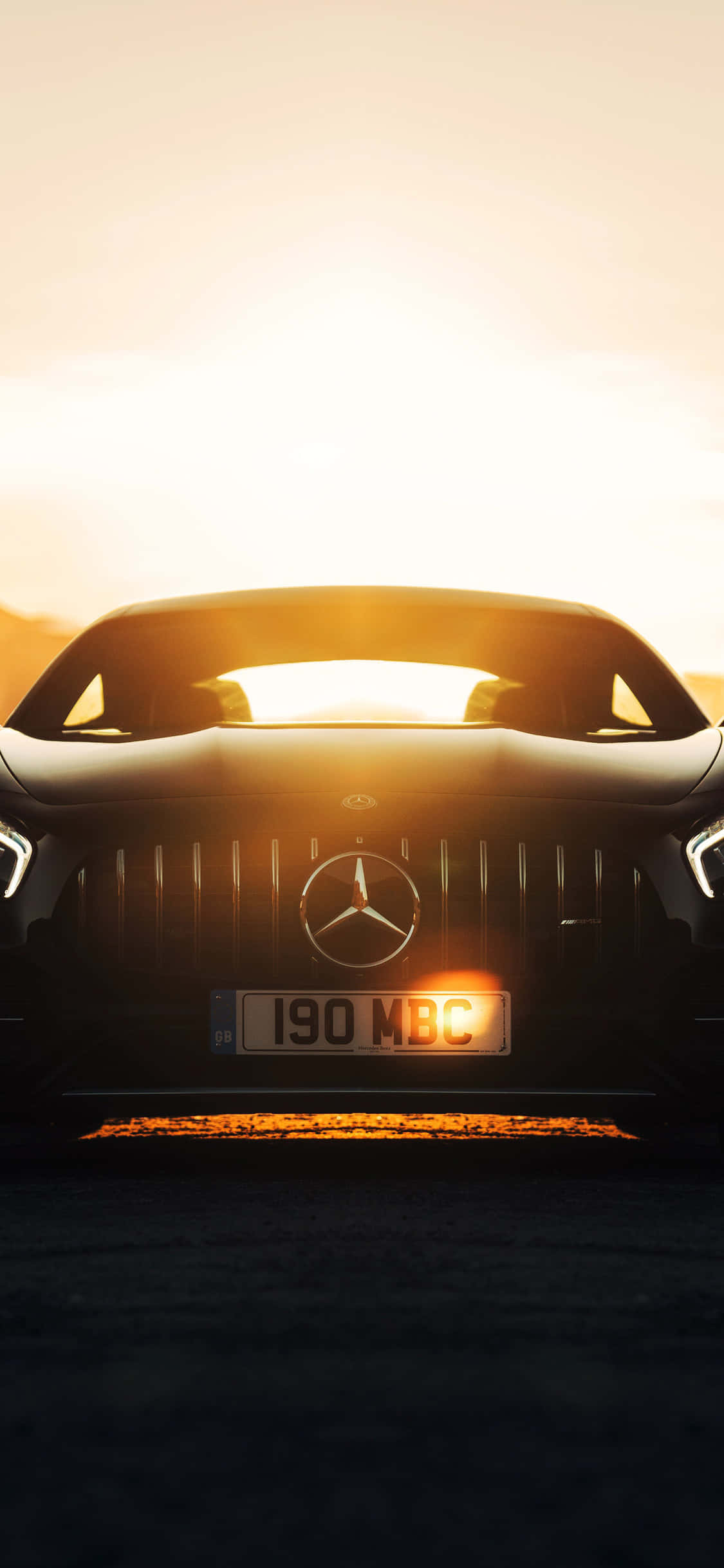 Fondo de iPhone X AMG GT-R bajo la luz del sol Fondos de pantalla