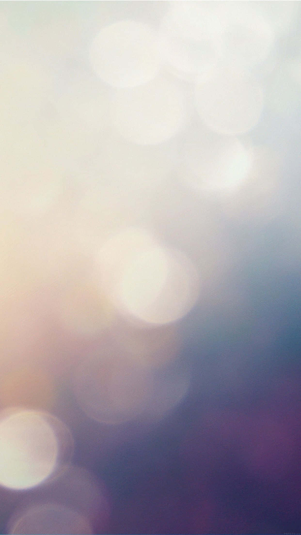 Fondo de pantalla predeterminado del iPhone 6s con luces bokeh Fondos de pantalla
