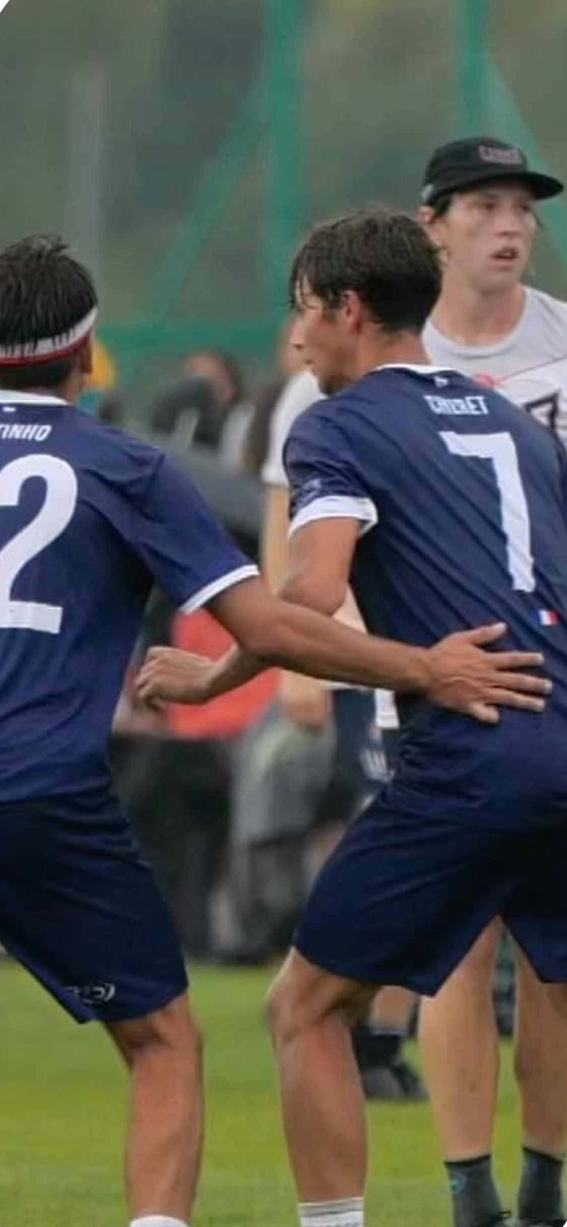 Fondo de ultimate frisbee para iPhone X con uniformes azules Fondos de pantalla