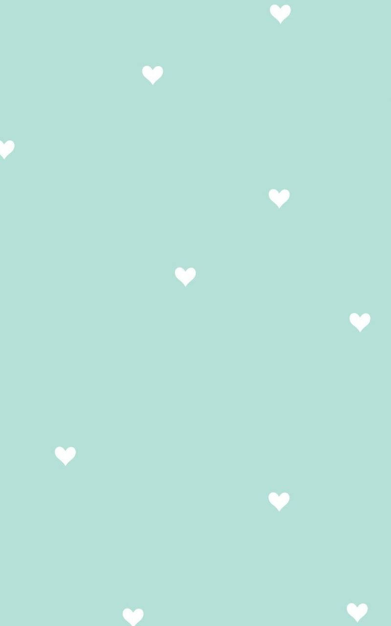 Fondo estético verde claro con pequeños corazones blancos Fondos de pantalla