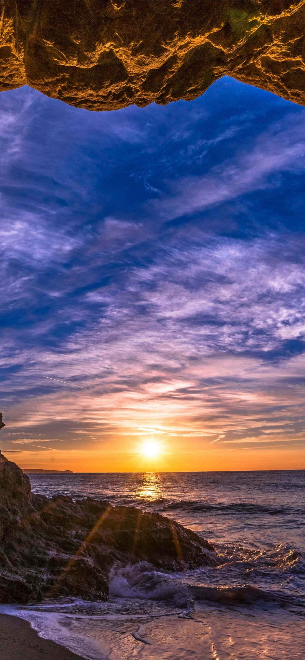 Fondo de Malibú para iPhone X dentro de una cueva Fondos de pantalla