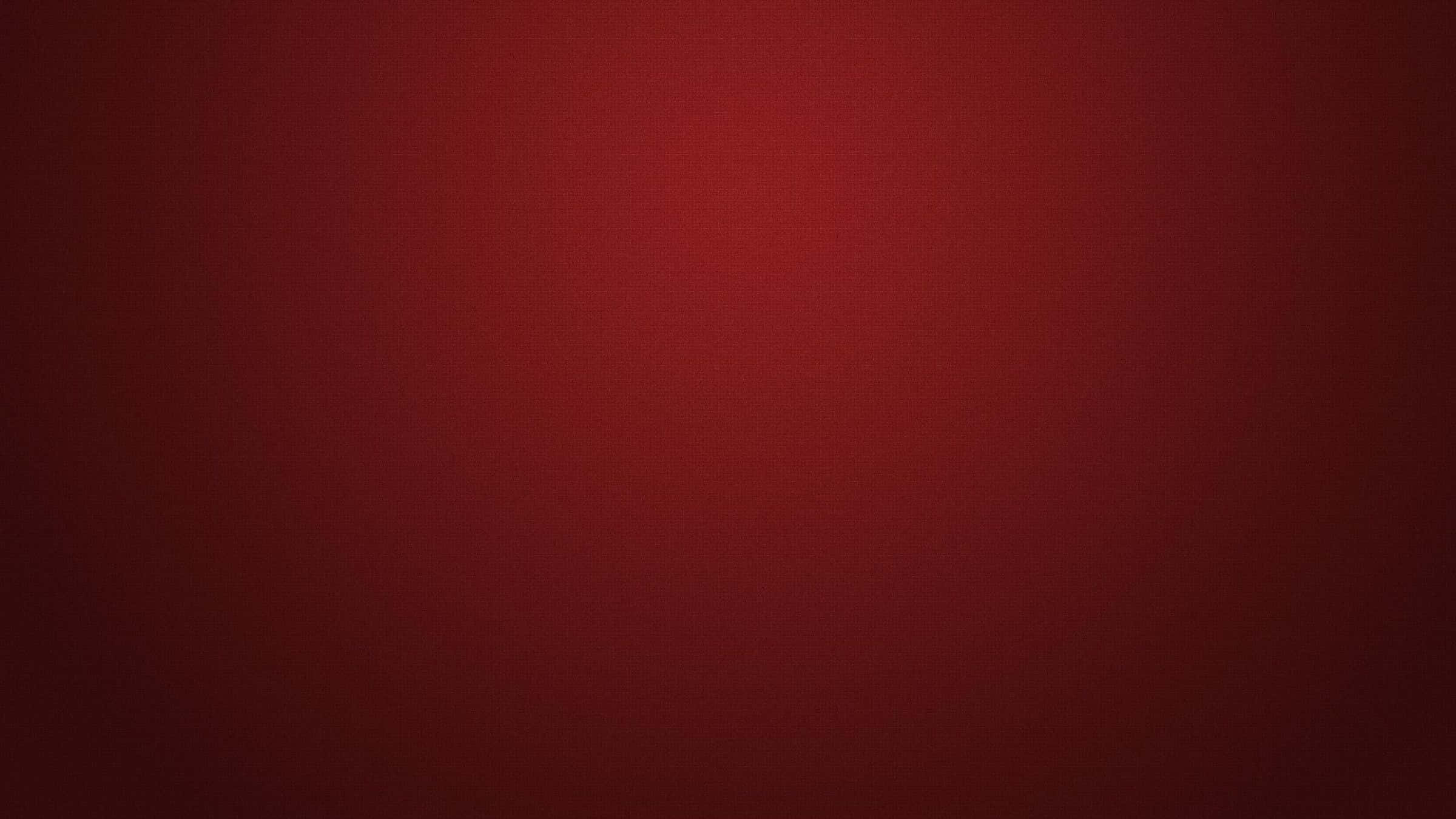 Fondo rojo oscuro con esquinas oscuras y centro brillante Fondos de pantalla
