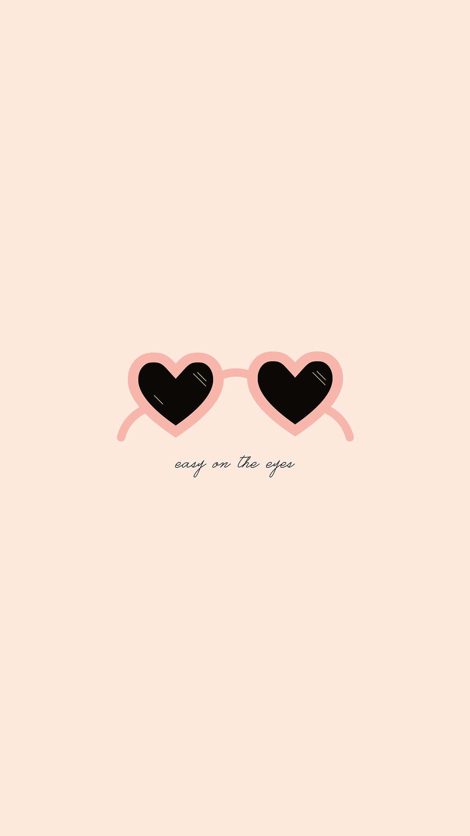 gafas de sol en forma de corazón rosas y negras sobre fondo beige Fondos de pantalla