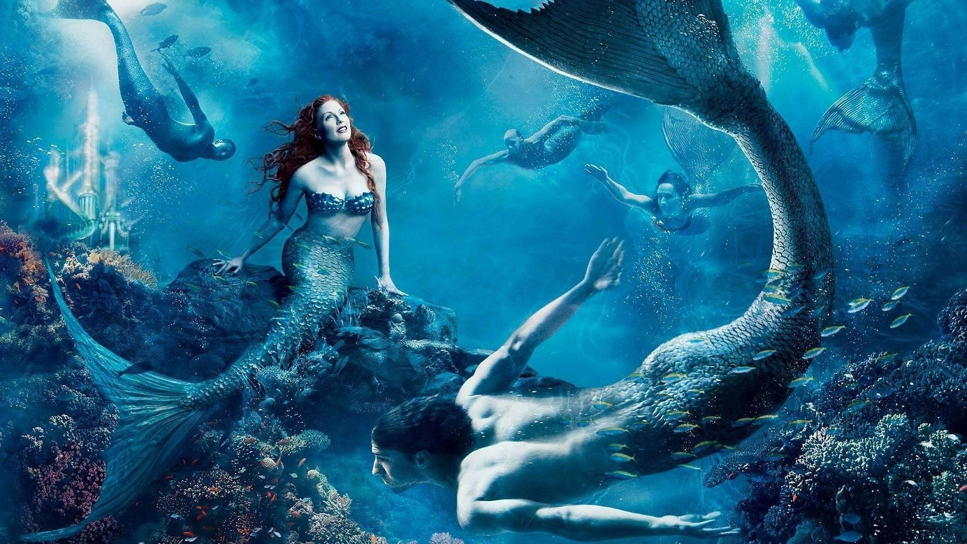 Fondo de pantalla de grupo de sirenas nadando bajo el agua.