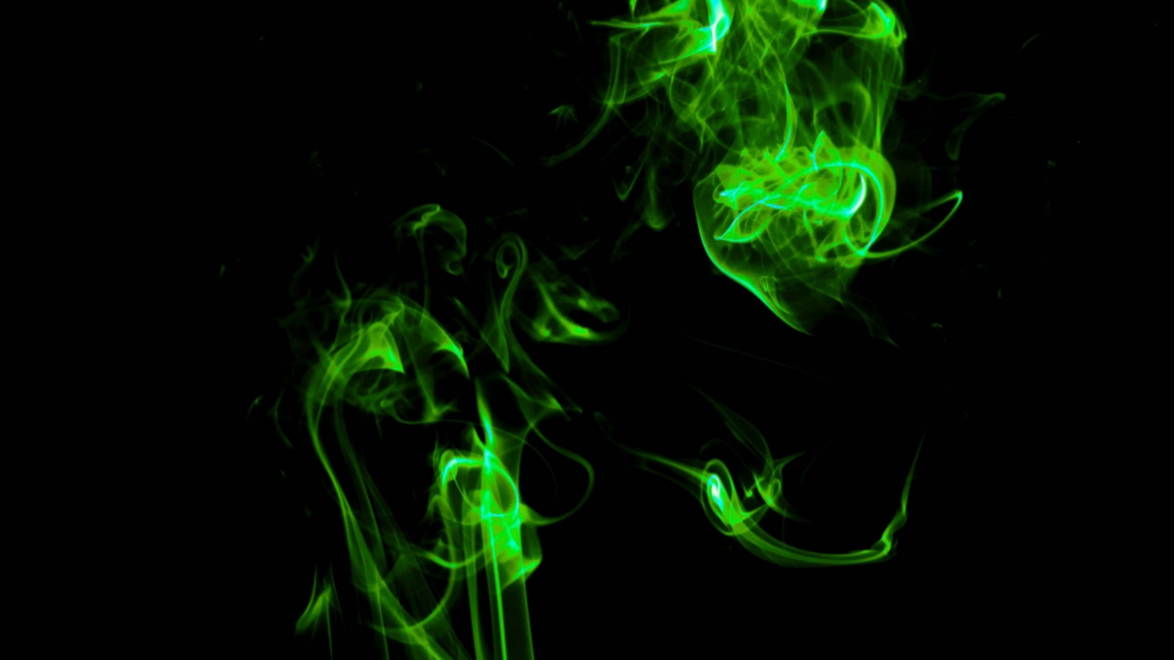Humo verde neón girando en negro Fondos de pantalla