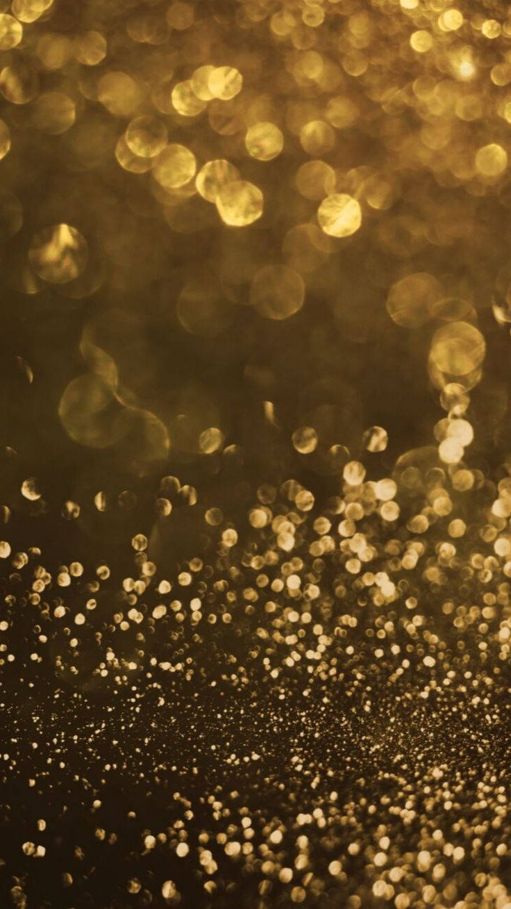 iPhone de Brillo Dorado con Destellos de Ensueño Fondos de pantalla