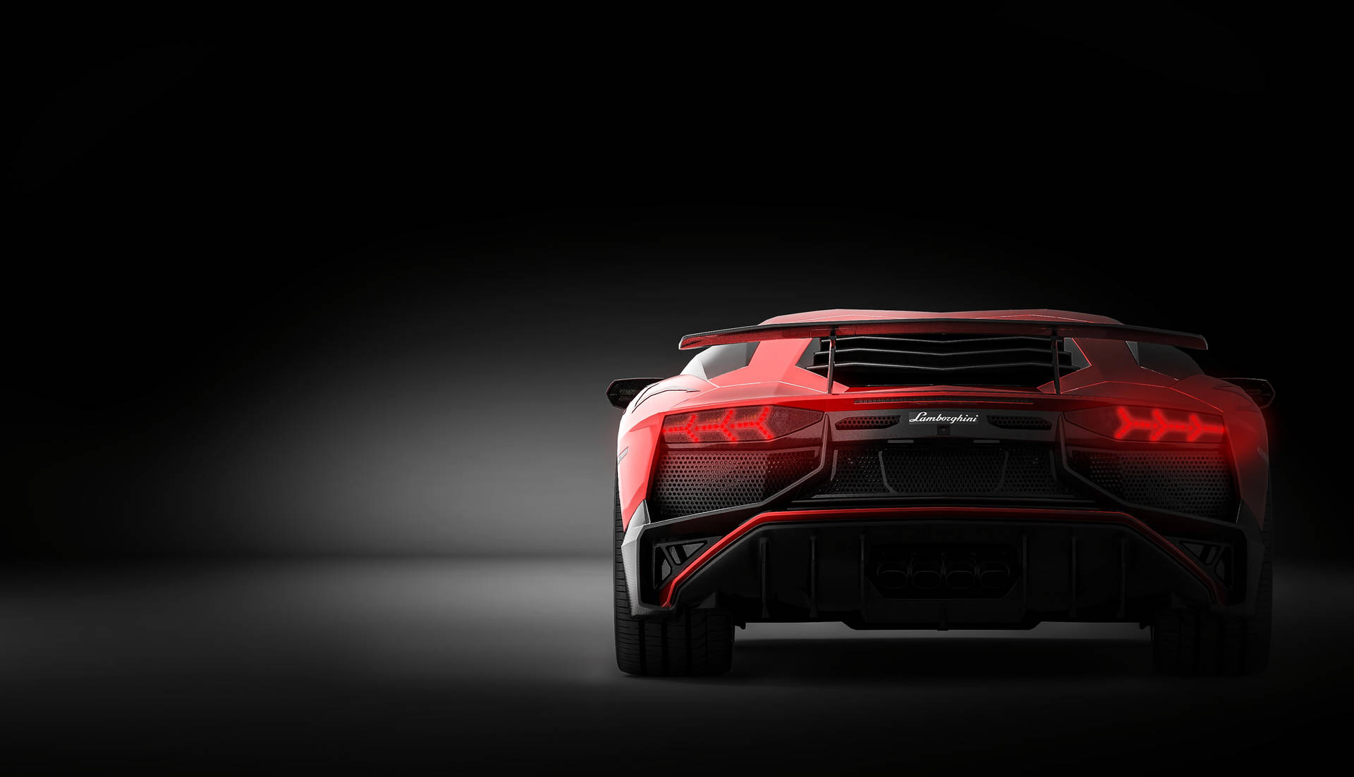 Fondo de pantalla del Lamborghini Aventador rojo vista trasera.