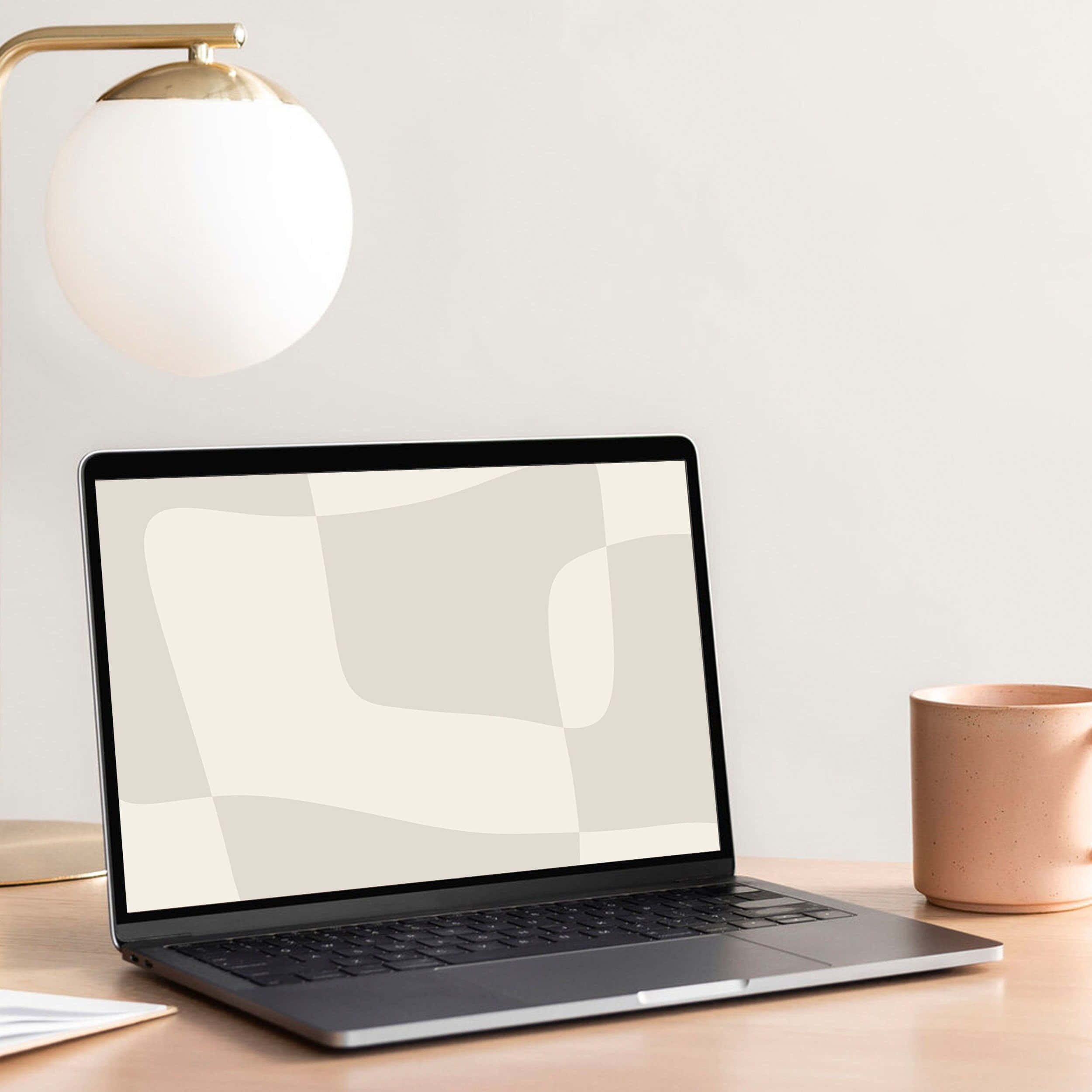 Laptop estético que añade un toque de clase a cualquier oficina en casa Fondos de pantalla