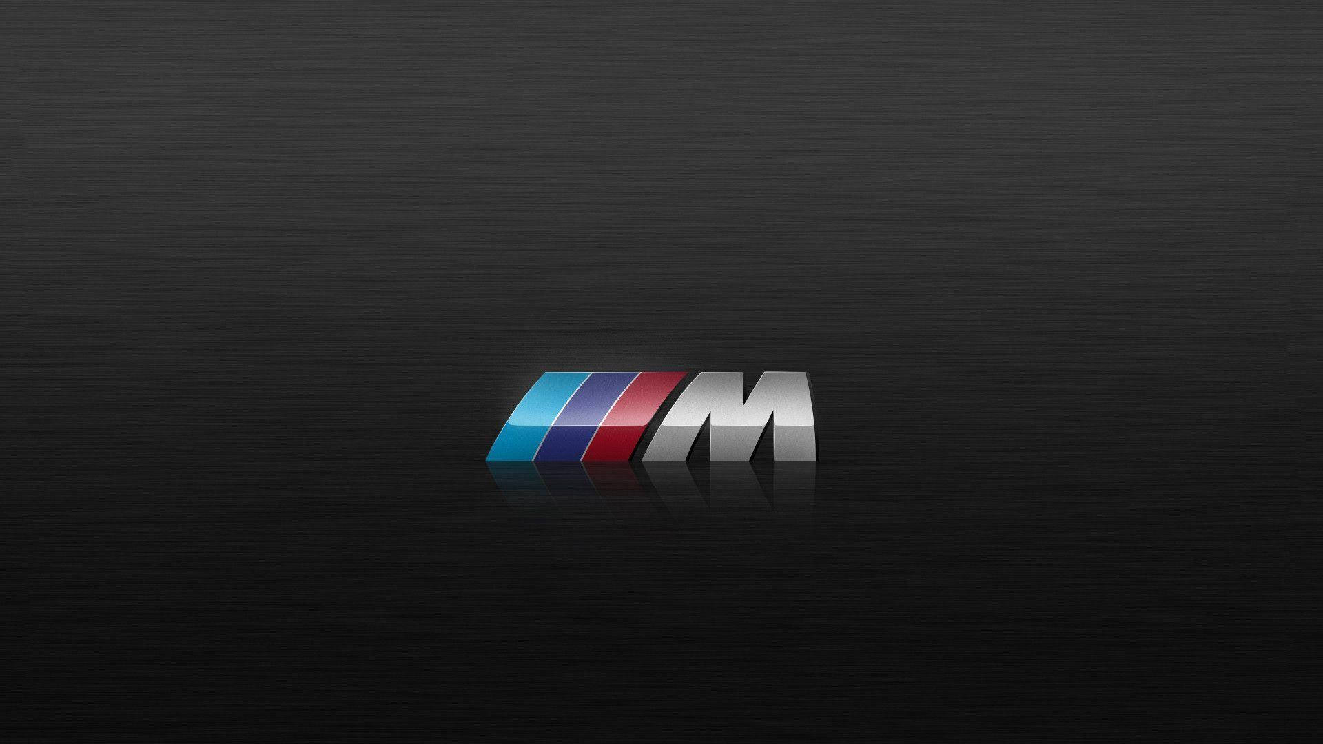 Logo BMW M sobre textura de madera negra Fondos de pantalla