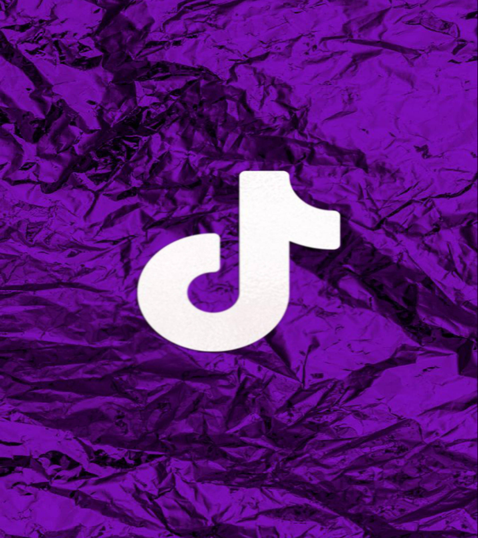 Logo de TikTok en tela drapeada púrpura oscura Fondos de pantalla