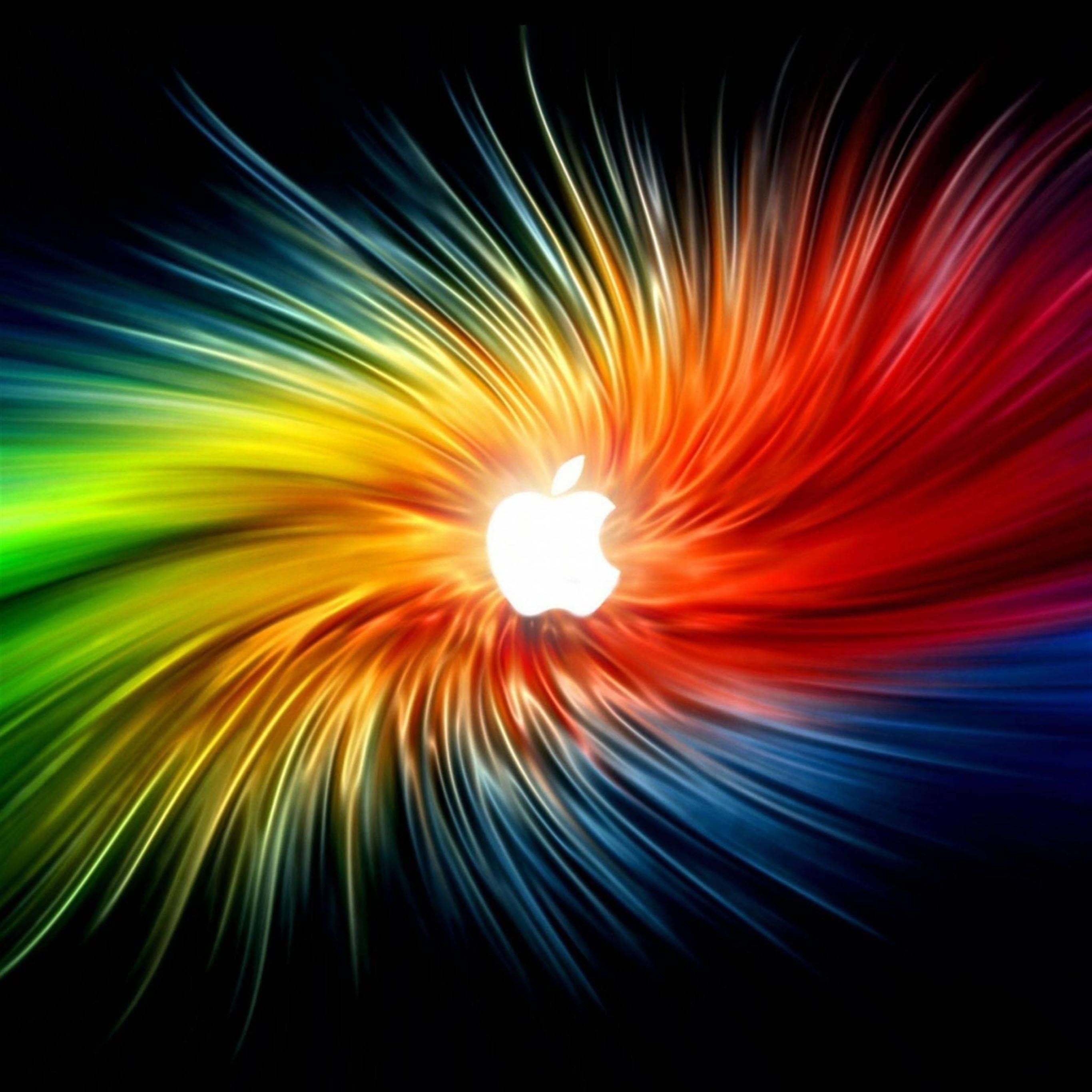 Logotipo de Apple en iPad Pro sobre tela arcoíris Fondos de pantalla