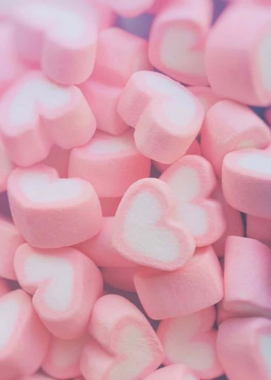 malvaviscos rosados en una pila sobre fondo blanco Fondos de pantalla
