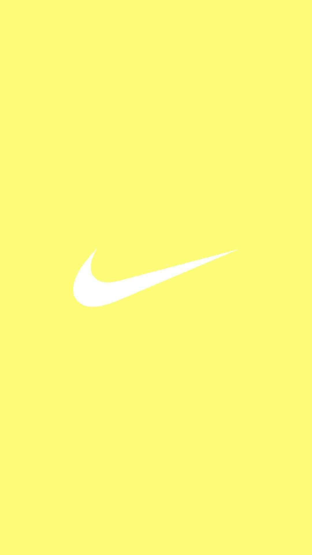 Nike Logo Fondo Amarillo Liso Teléfono Fondos de pantalla