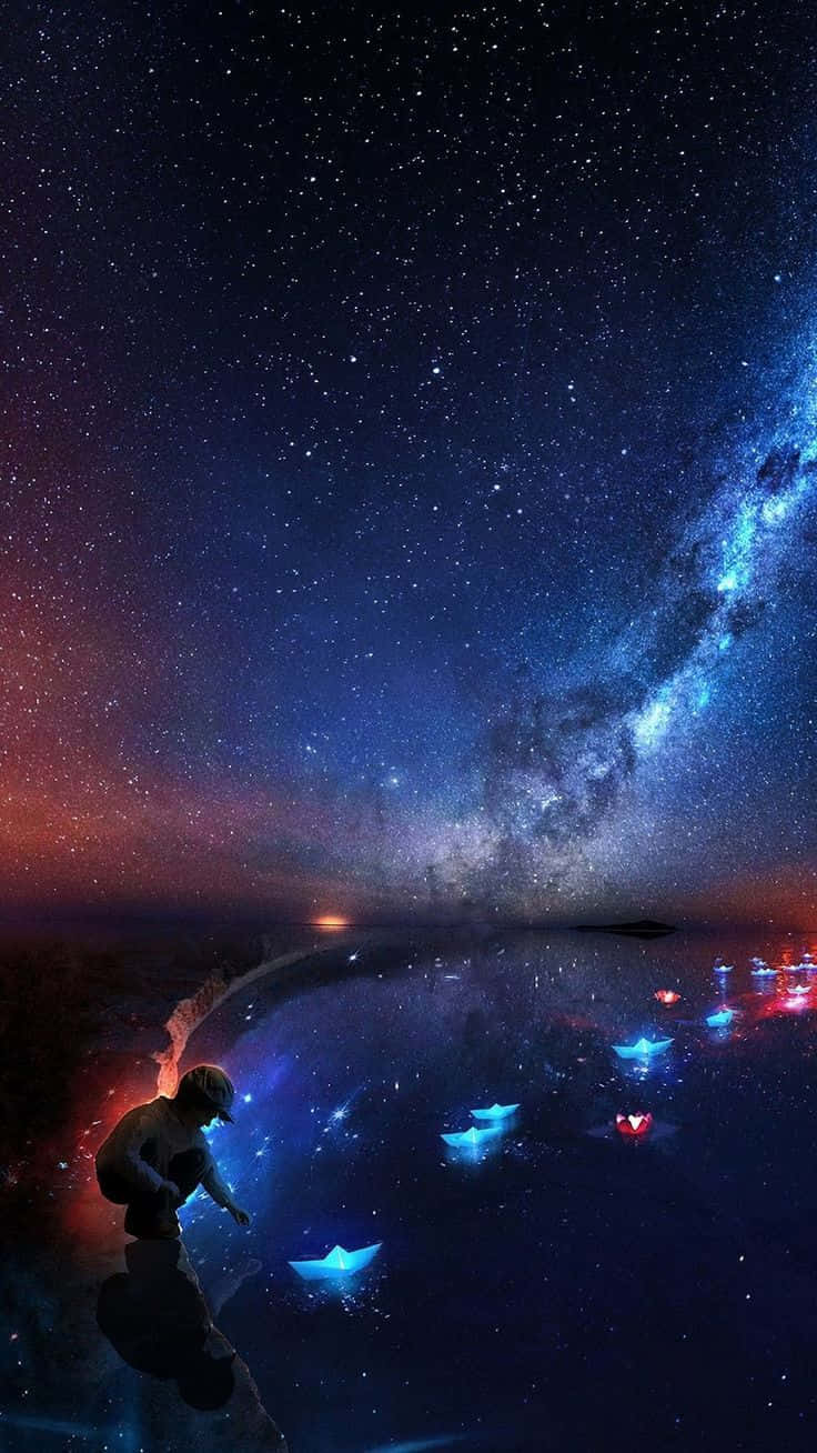 Cielo nocturno mágico con niño jugando con barcos de papel Fondos de pantalla