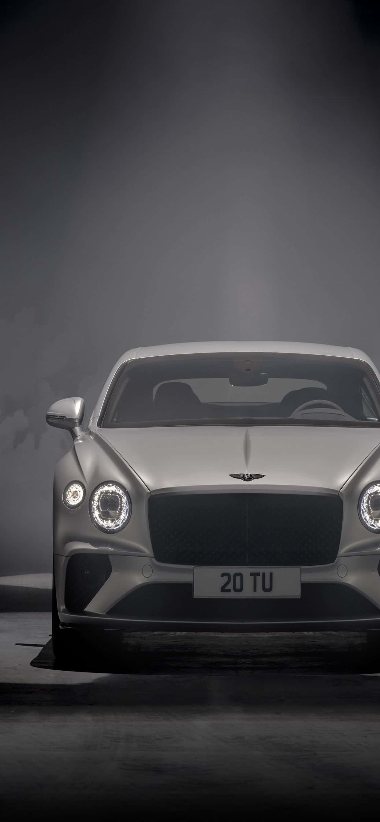 Sumérgete en el lujo: Un iPhone Xs Max en un Bentley Fondos de pantalla