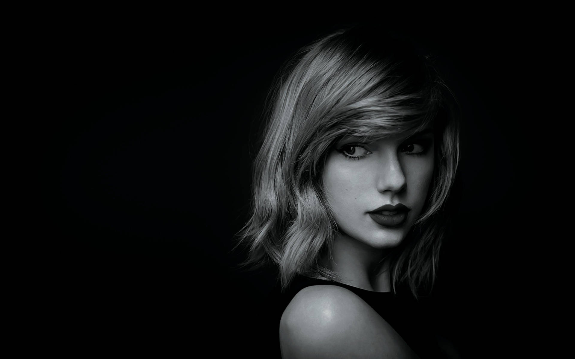 Retrato en blanco y negro de Taylor Swift, compositora o cantante.