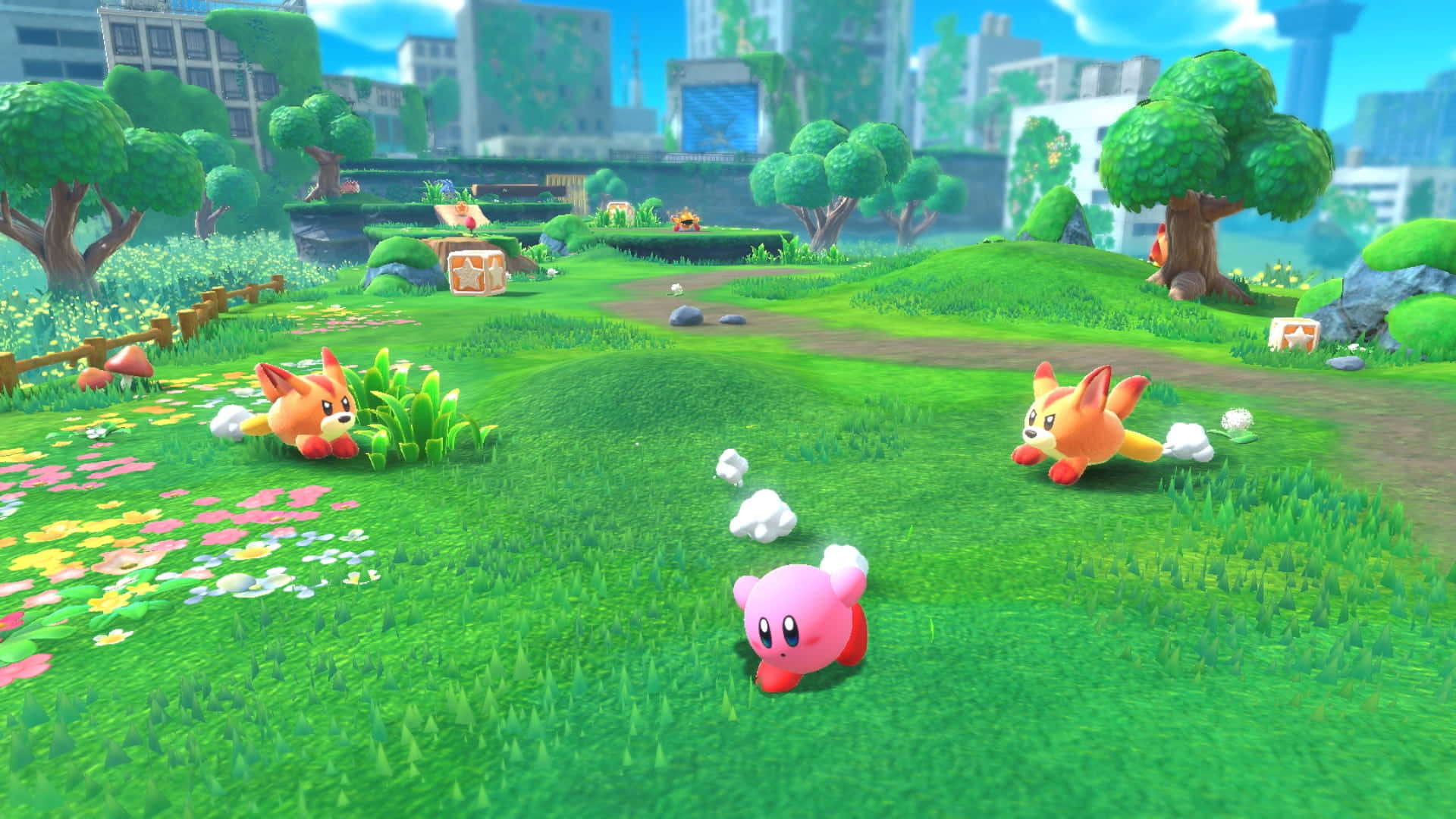 Un adorable Kirby sentado en un montón de estrellas coloridas Fondos de pantalla