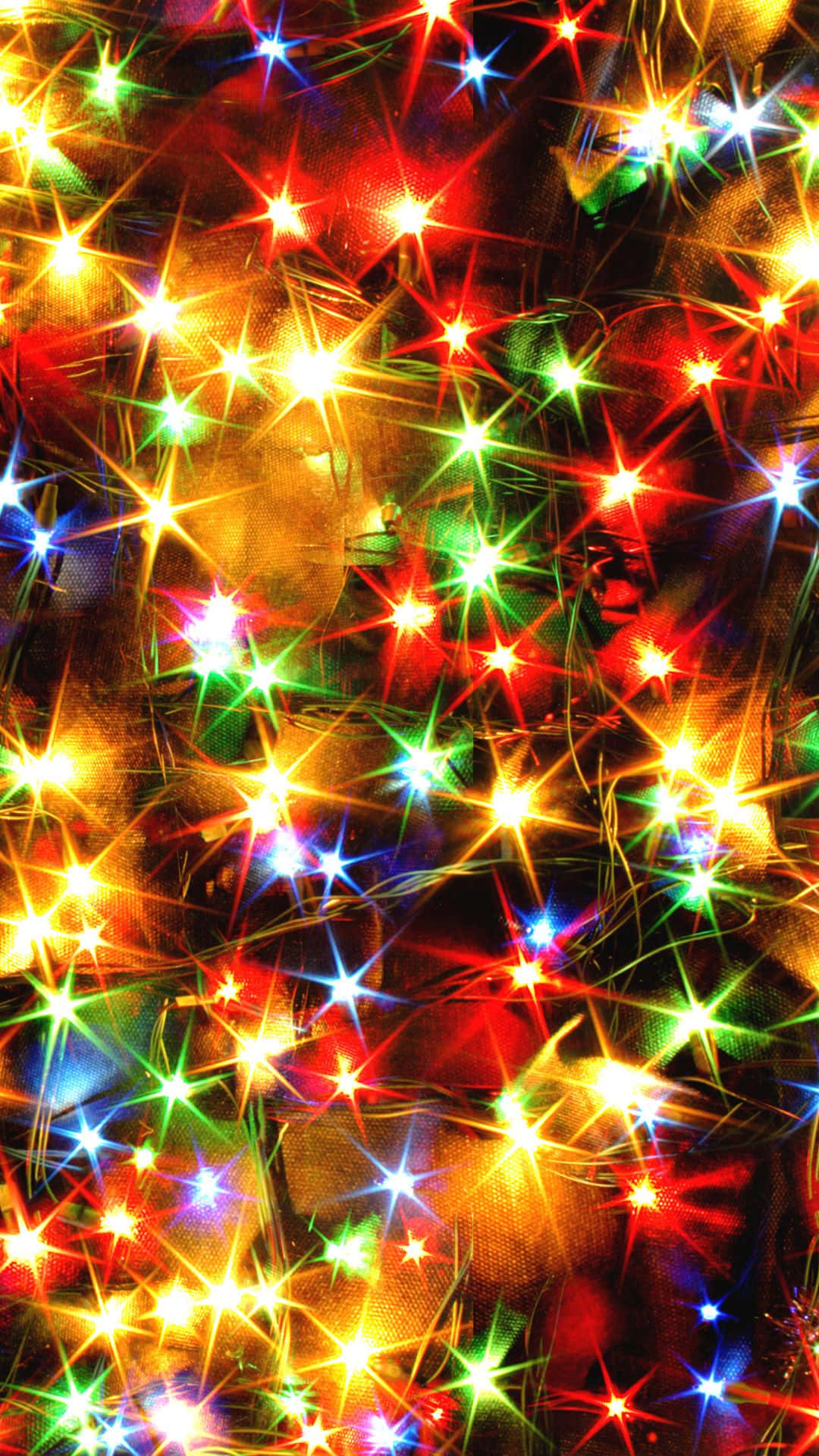 Un árbol de Navidad con luces encendidas Fondos de pantalla