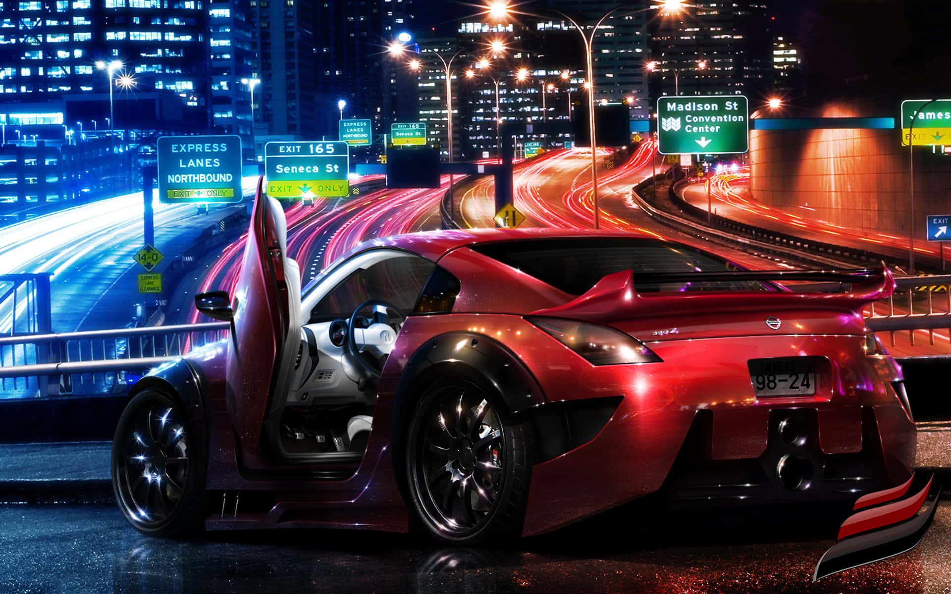 un auto deportivo rojo conduciendo por la calle de noche Fondos de pantalla