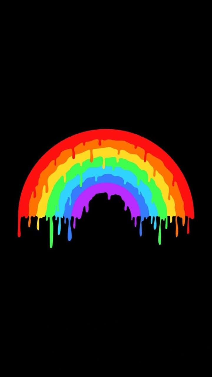Un caleidoscopio de colores vibrantes cubre el cielo, creando una hermosa estética de arcoíris Fondos de pantalla