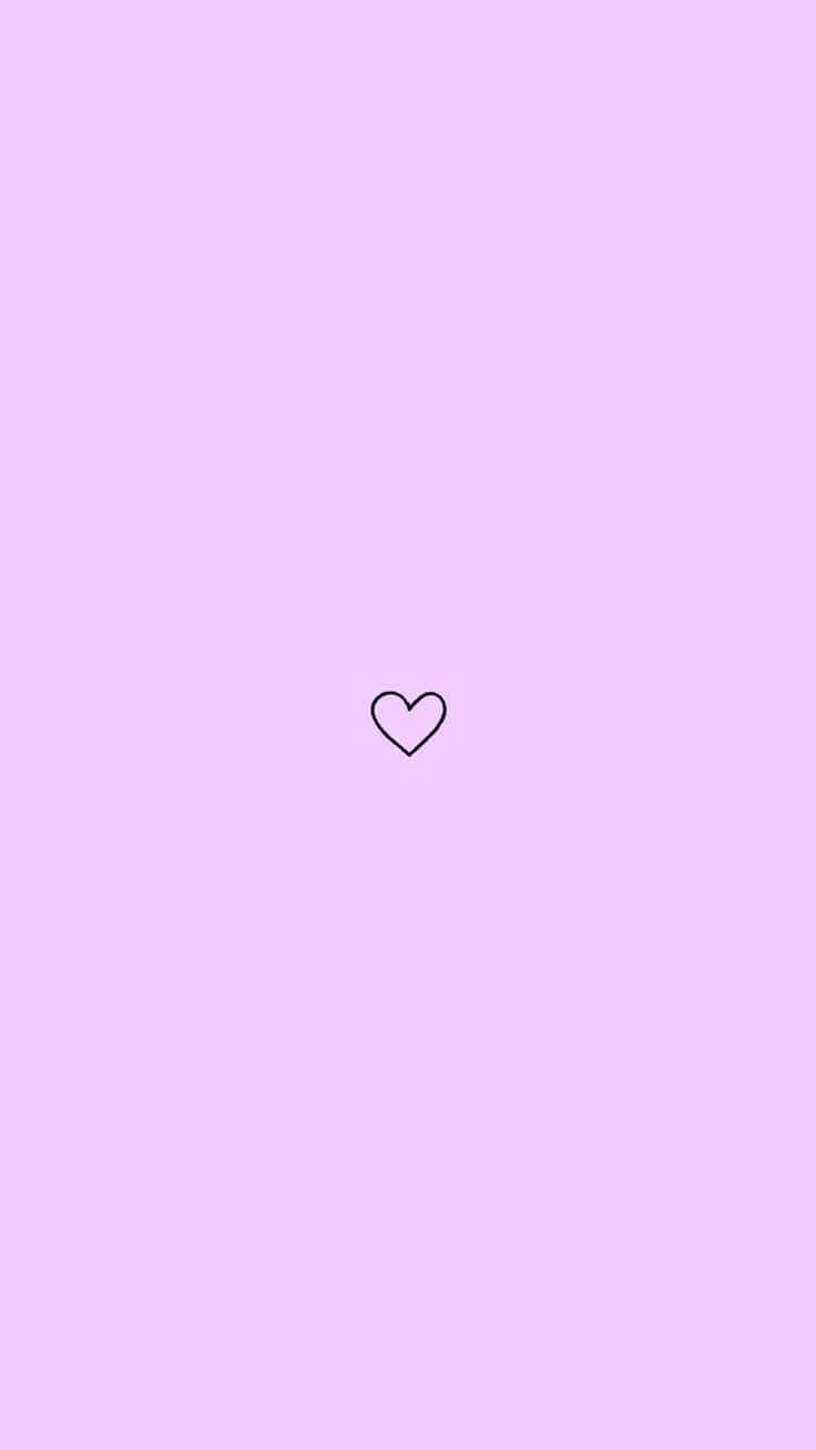 un corazón sobre un fondo rosa Fondos de pantalla