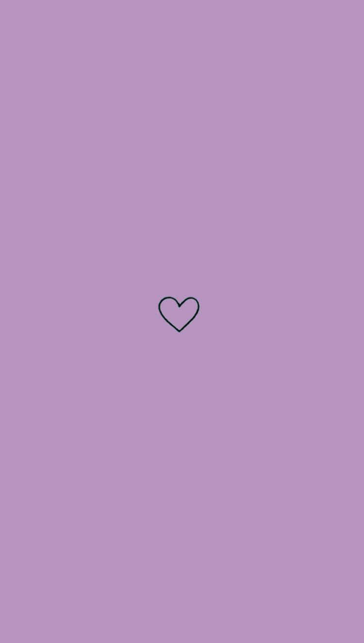 un corazón sobre fondo morado Fondos de pantalla