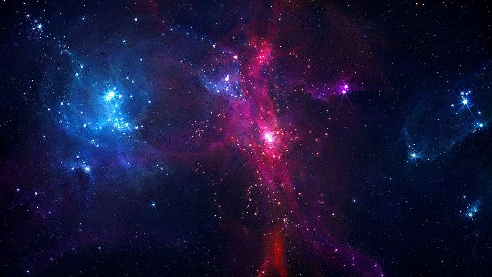 un espacio azul y morado con estrellas y nebulosas Fondos de pantalla