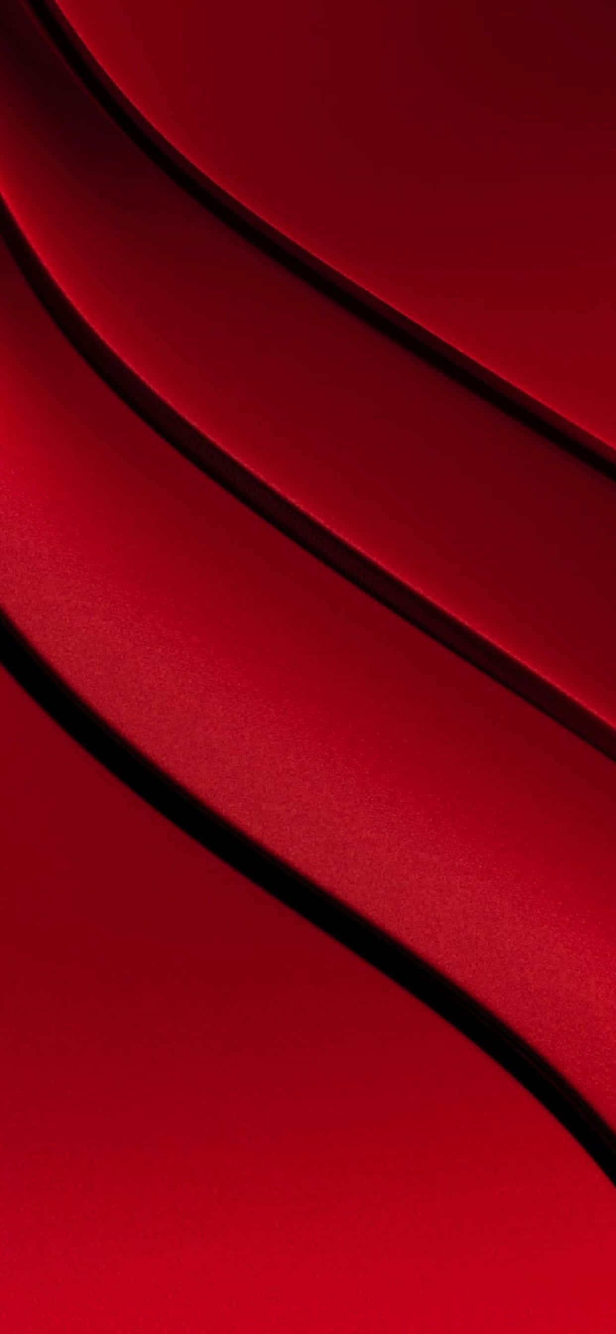 un fondo rojo con una forma curva Fondos de pantalla