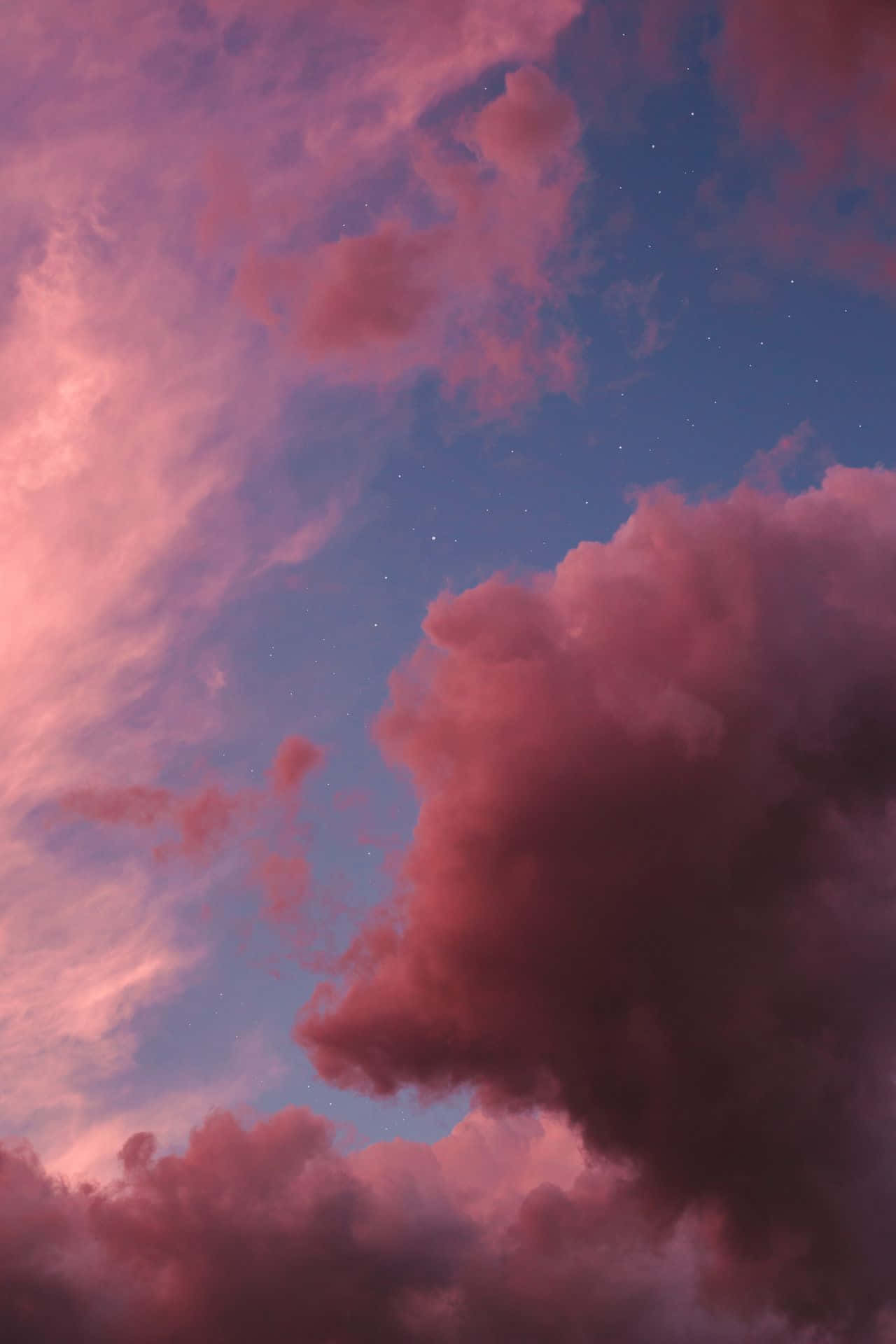 Un hermoso cielo con tonos rosas y naranjas Fondos de pantalla