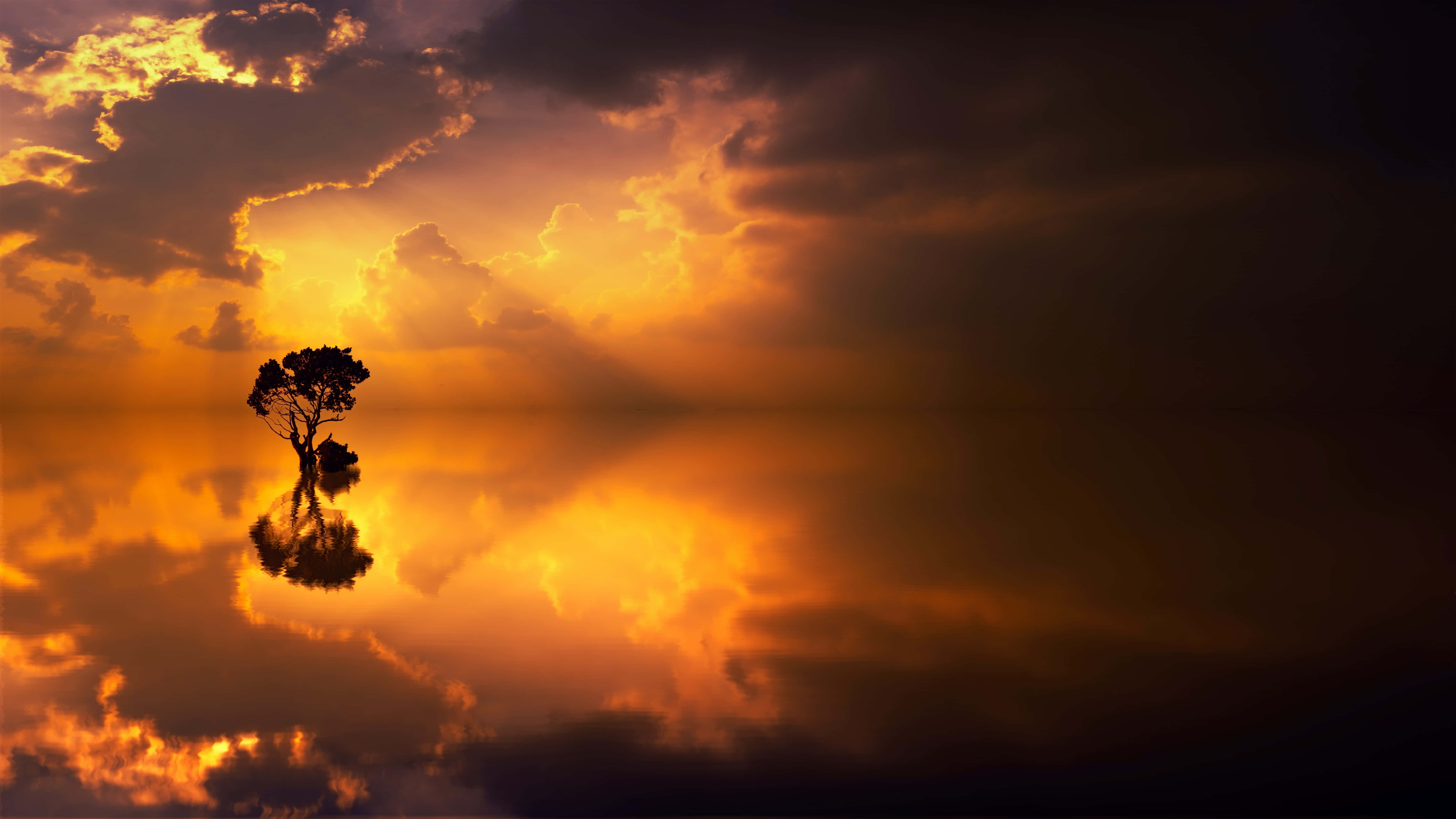 Un hermoso y tranquilo atardecer que refleja la belleza de la naturaleza Fondos de pantalla
