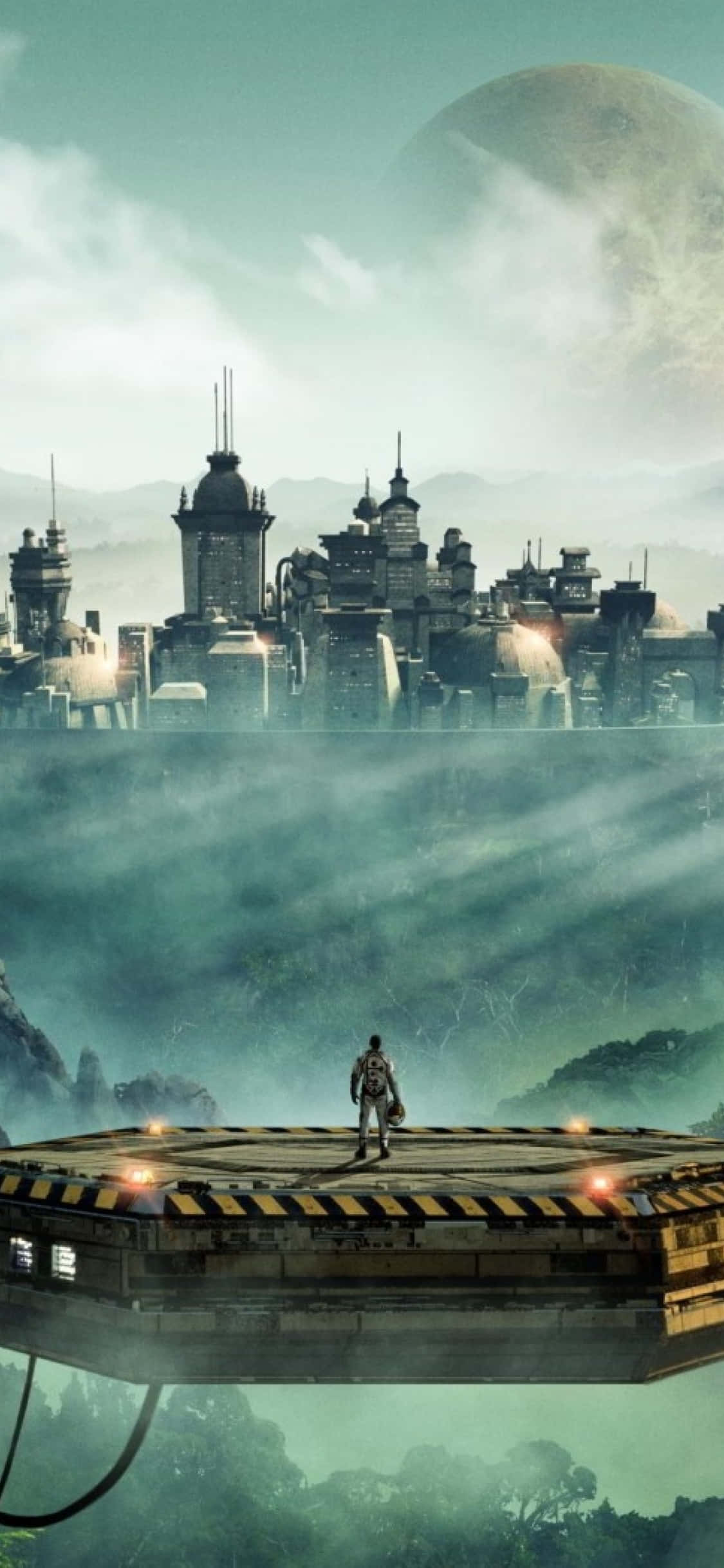 Un hombre está de pie en una plataforma frente a una ciudad Fondos de pantalla