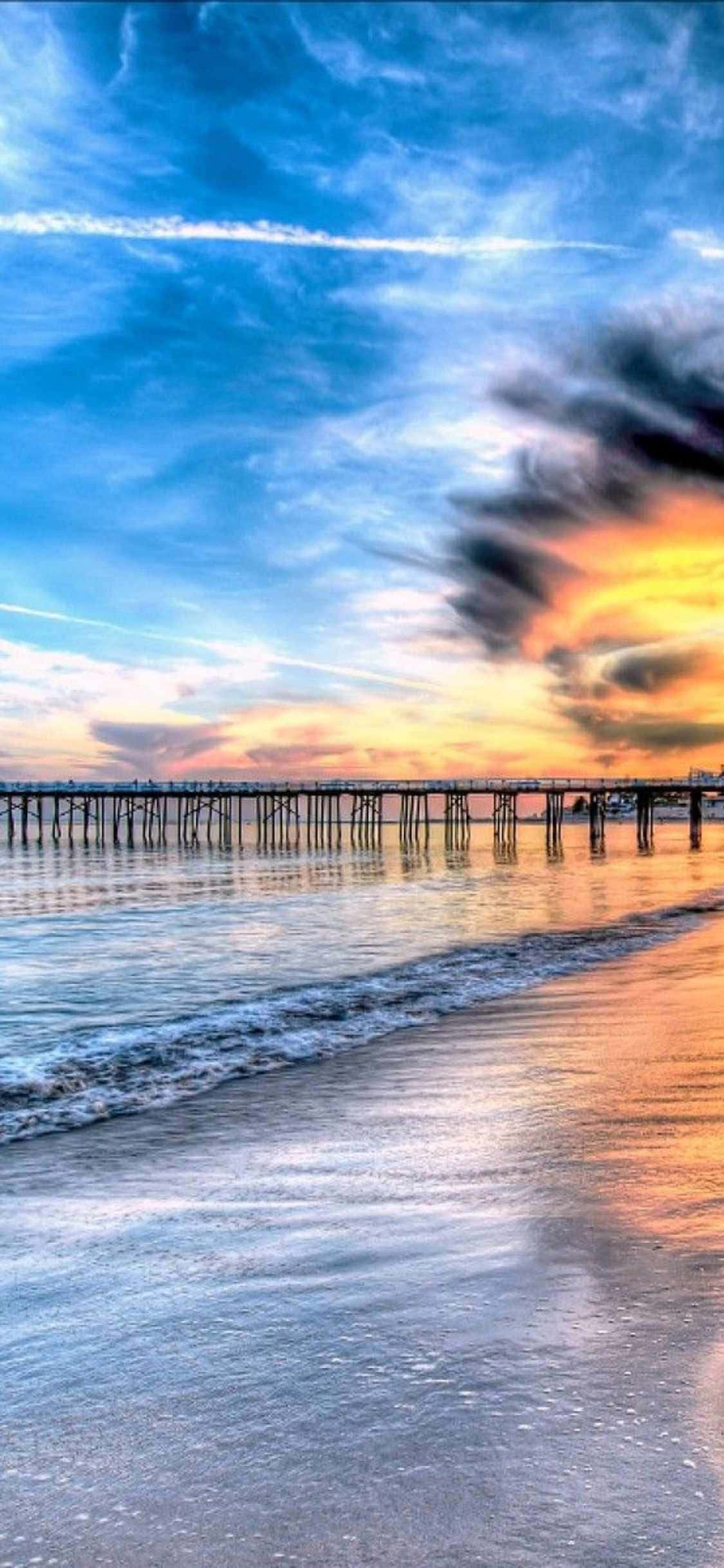 Un muelle con un atardecer sobre el océano Fondos de pantalla