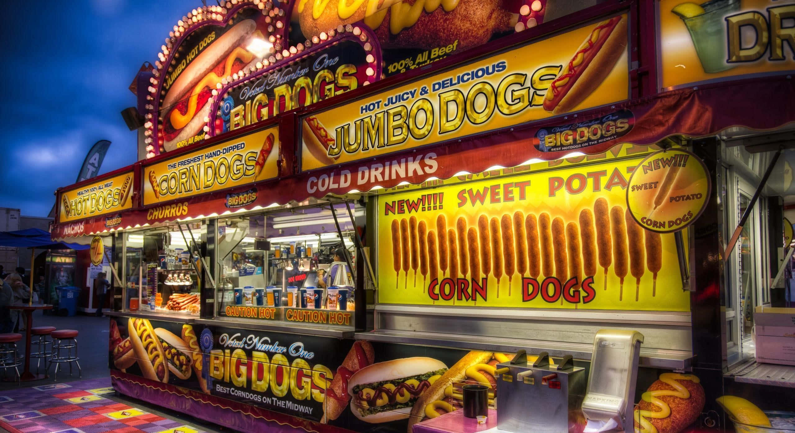 un puesto de hot dogs en una feria Fondos de pantalla