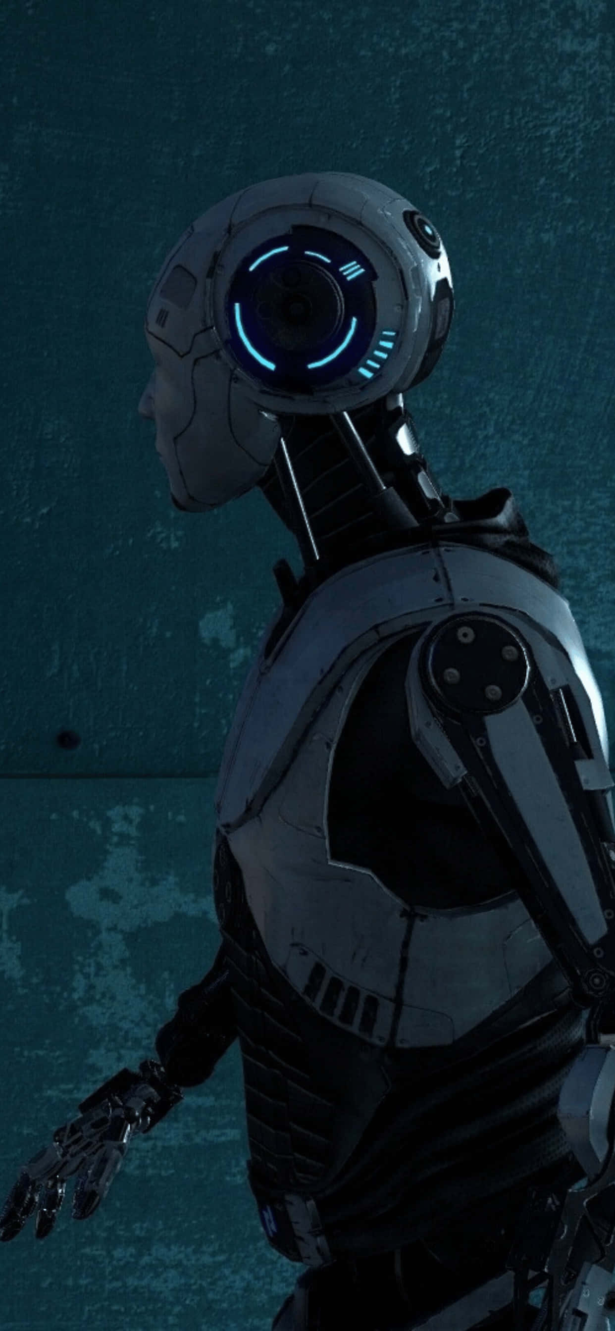 Un robot con ojos azules está frente a una pared azul Fondos de pantalla