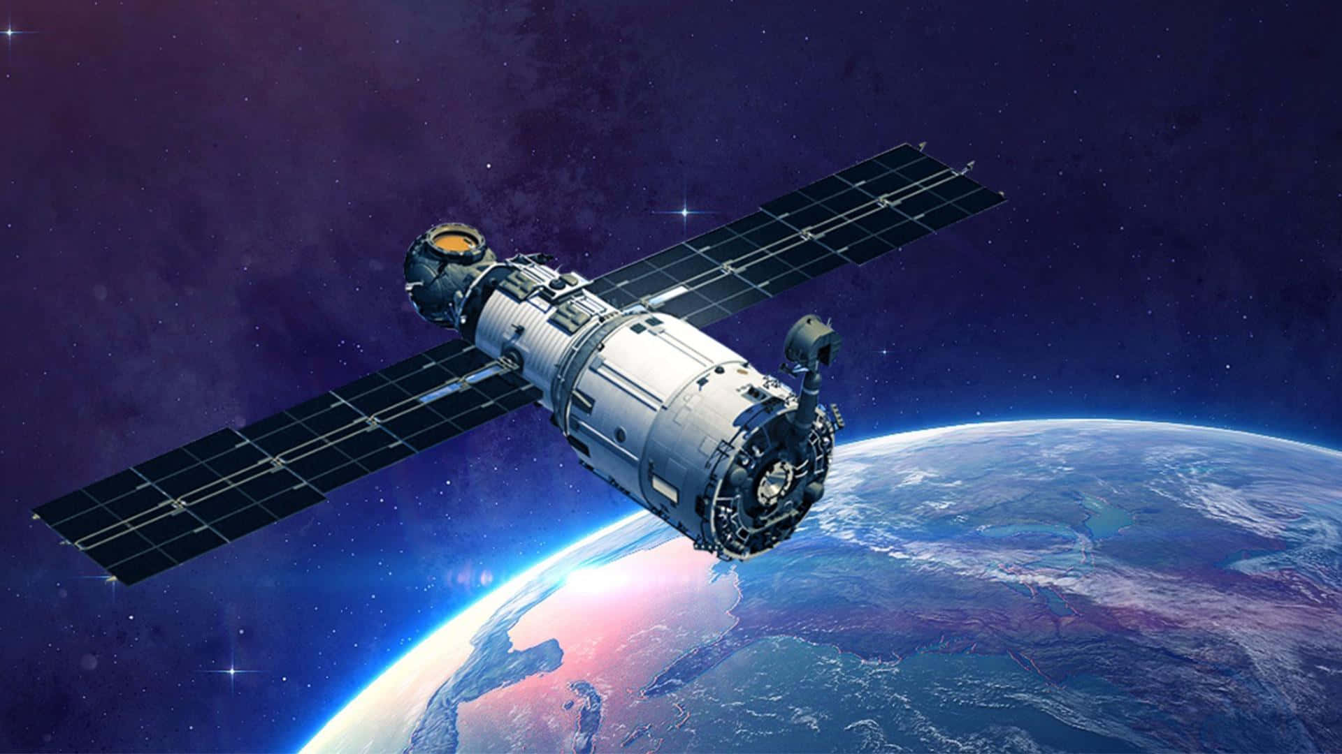 Un satélite sobrevolando la Tierra Fondos de pantalla